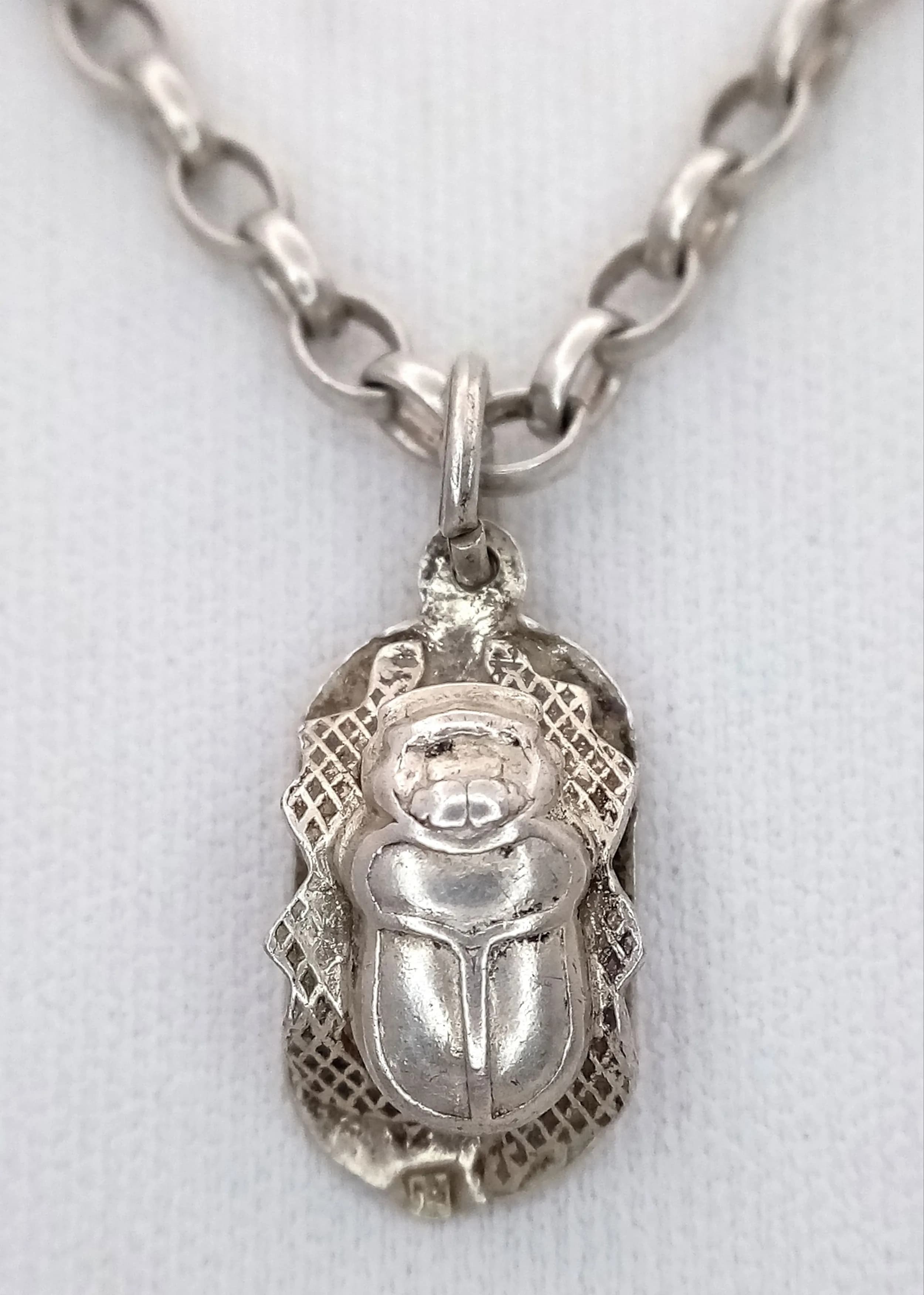 A Vintage 925 Sterling Silver Scarab Pendant Necklace - 35cm Length. Features a detailed Egyptian scarab pendant suspended from a belcher link chain. The pendant measures 1.5cm x 1cm. Gross weight 8.75 grams.