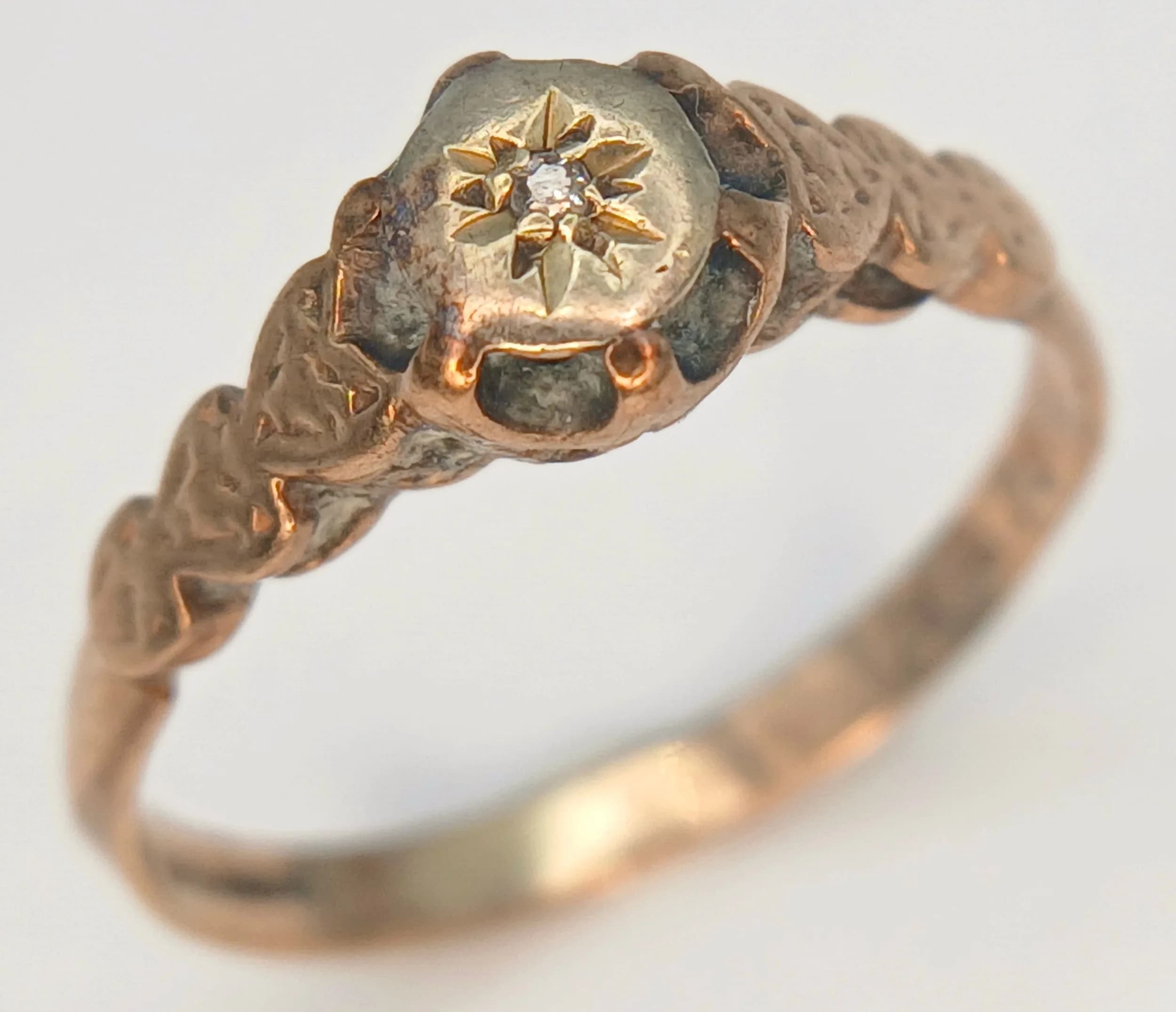 An Antique 9K Gold Stone Set Ring with Heart Shaped Shoulders. Size K 1/2. 1.55g total weight.