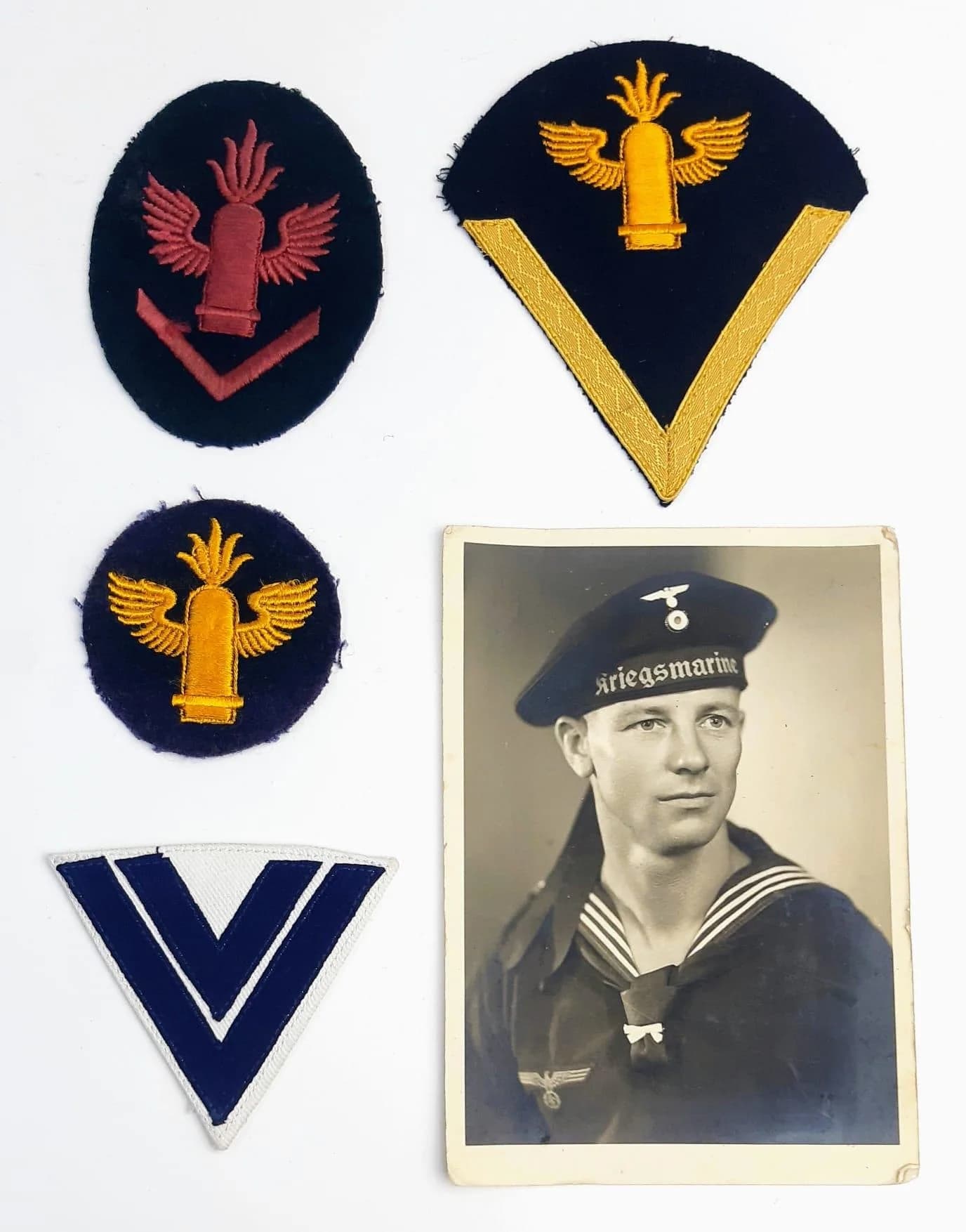 Four WW2 German Kriegsmarine Coastal Artillery Badges. Comes with a picture of the serviceman who wore them.