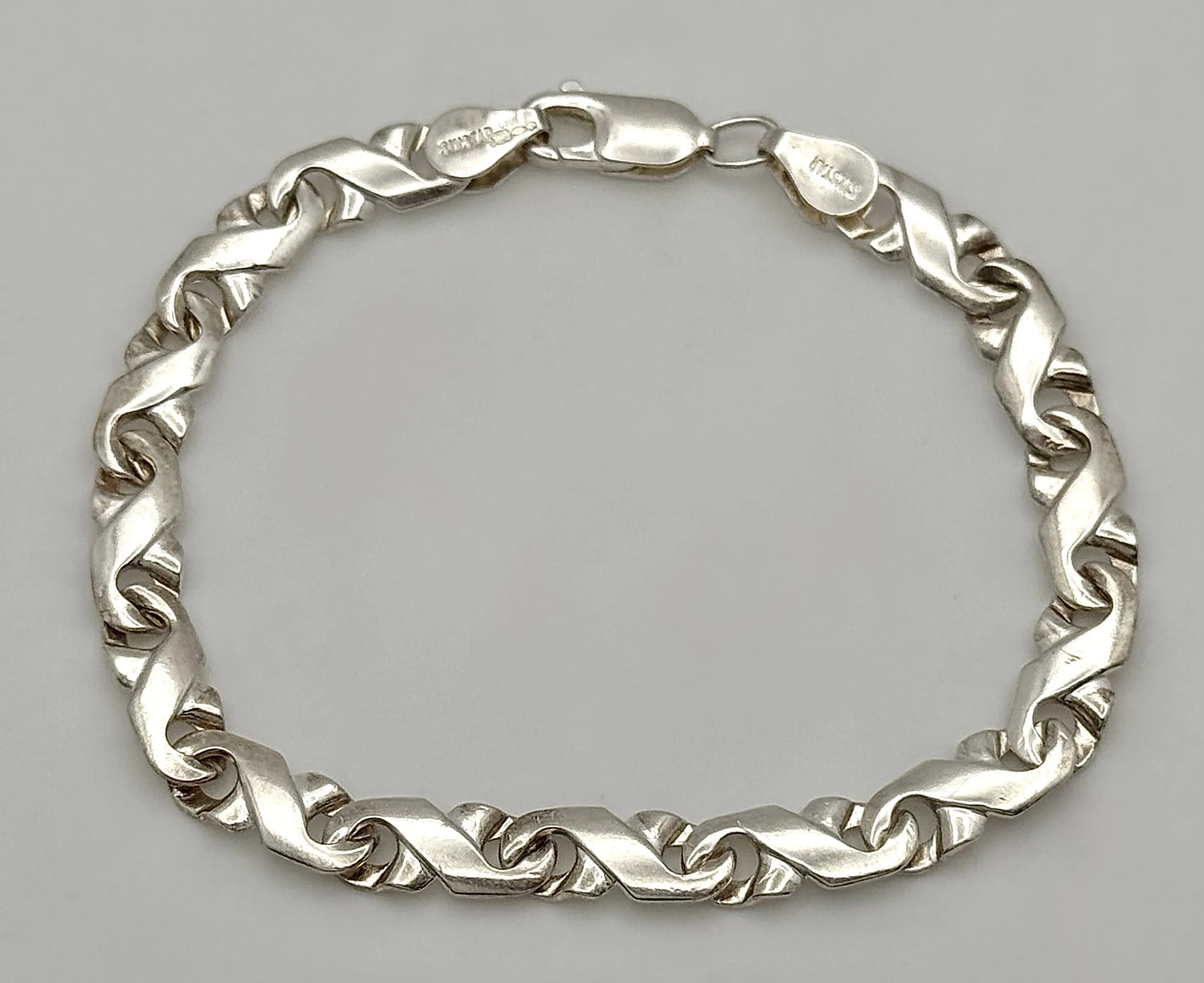 A Sixstar 925 Silver Bracelet. 18.5cm length. 8.35g weight.