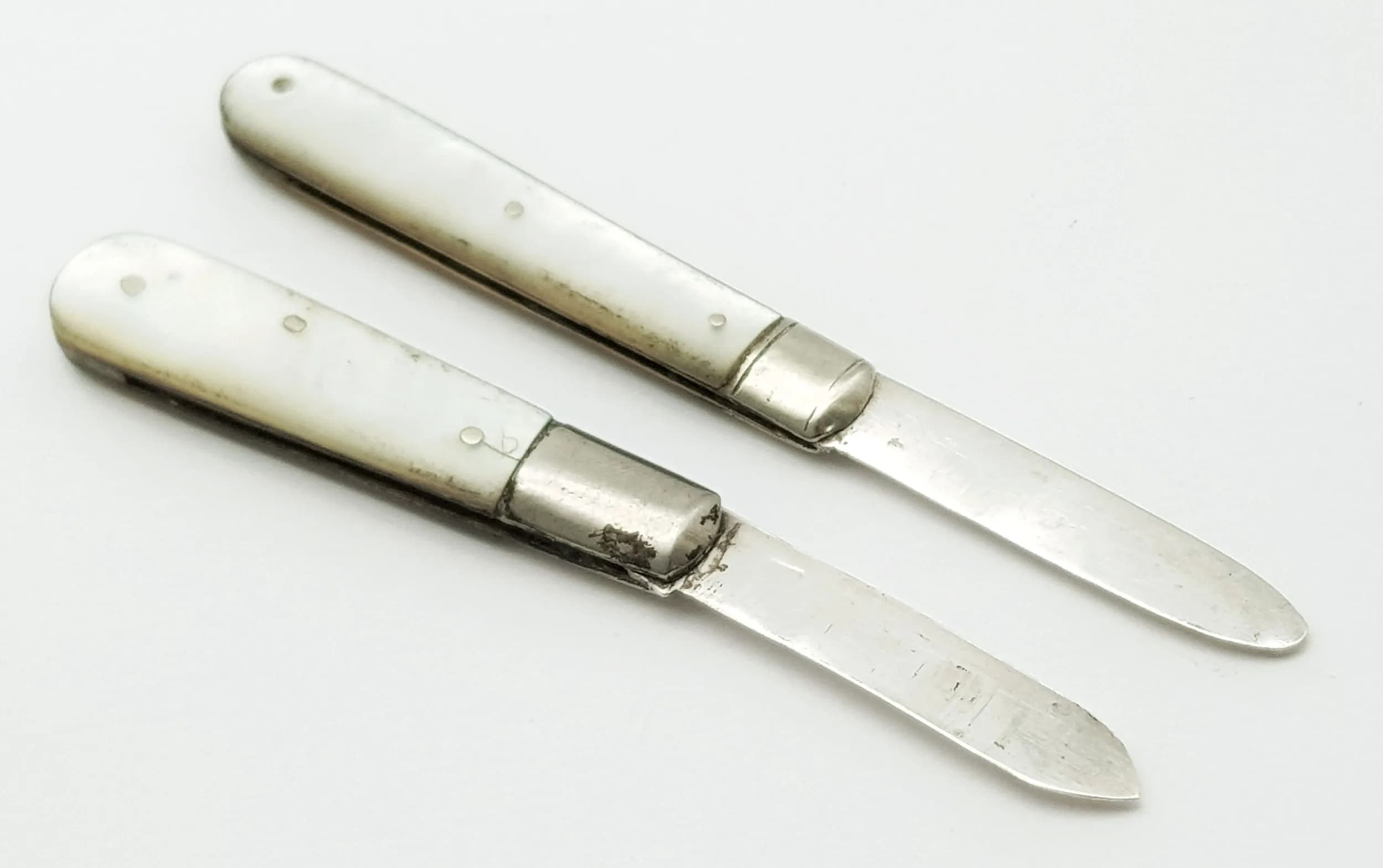 Two Antique Sterling Silver and Mother of Pearl Small Fruit Knives. Hallmarks on blade. 5cm.