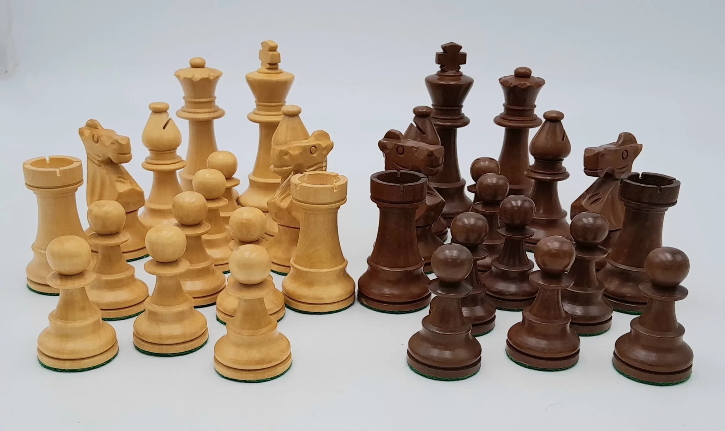 A White and Brown Boxwood Set of Chess Pieces. Indian origin having a felt bottom. 3.75" King.