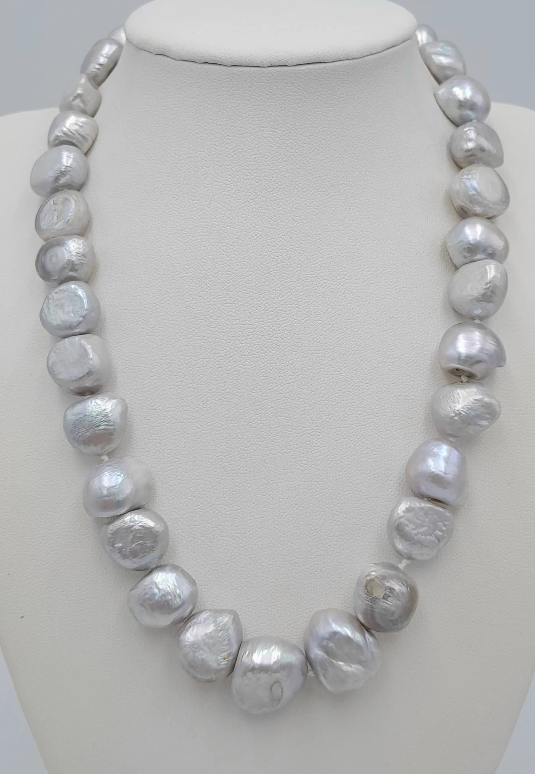 A Silver Tone Freshwater Irregular Shaped Pearl Necklace with 925 Silver Clasp. Pearls - 10/12mm. 42cm length. MK20.