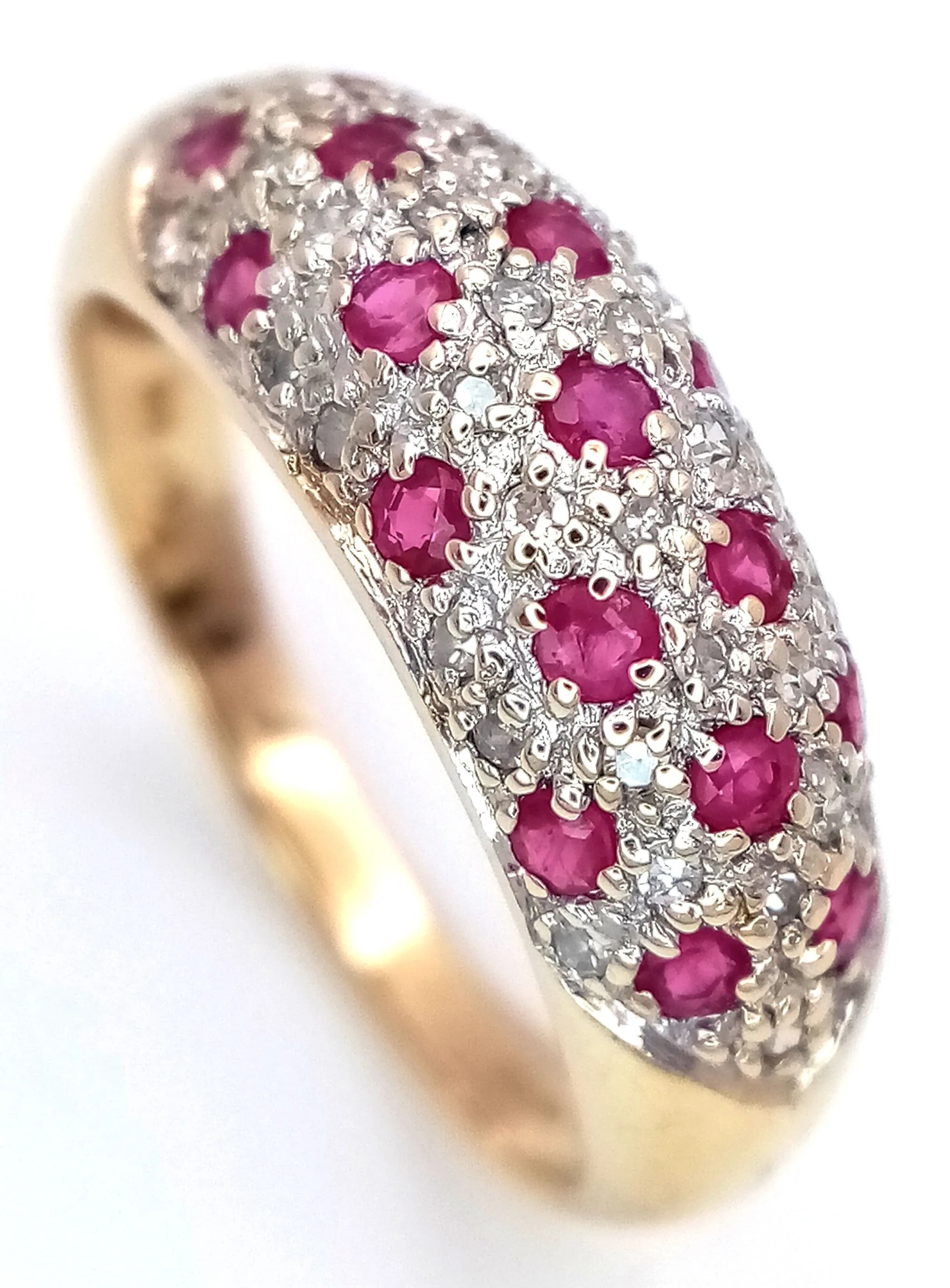 A 9K YELLOW GOLD, DIAMOND AND RUBY RING. 0.19CTW. 3.1G, SIZE O. SC 5036