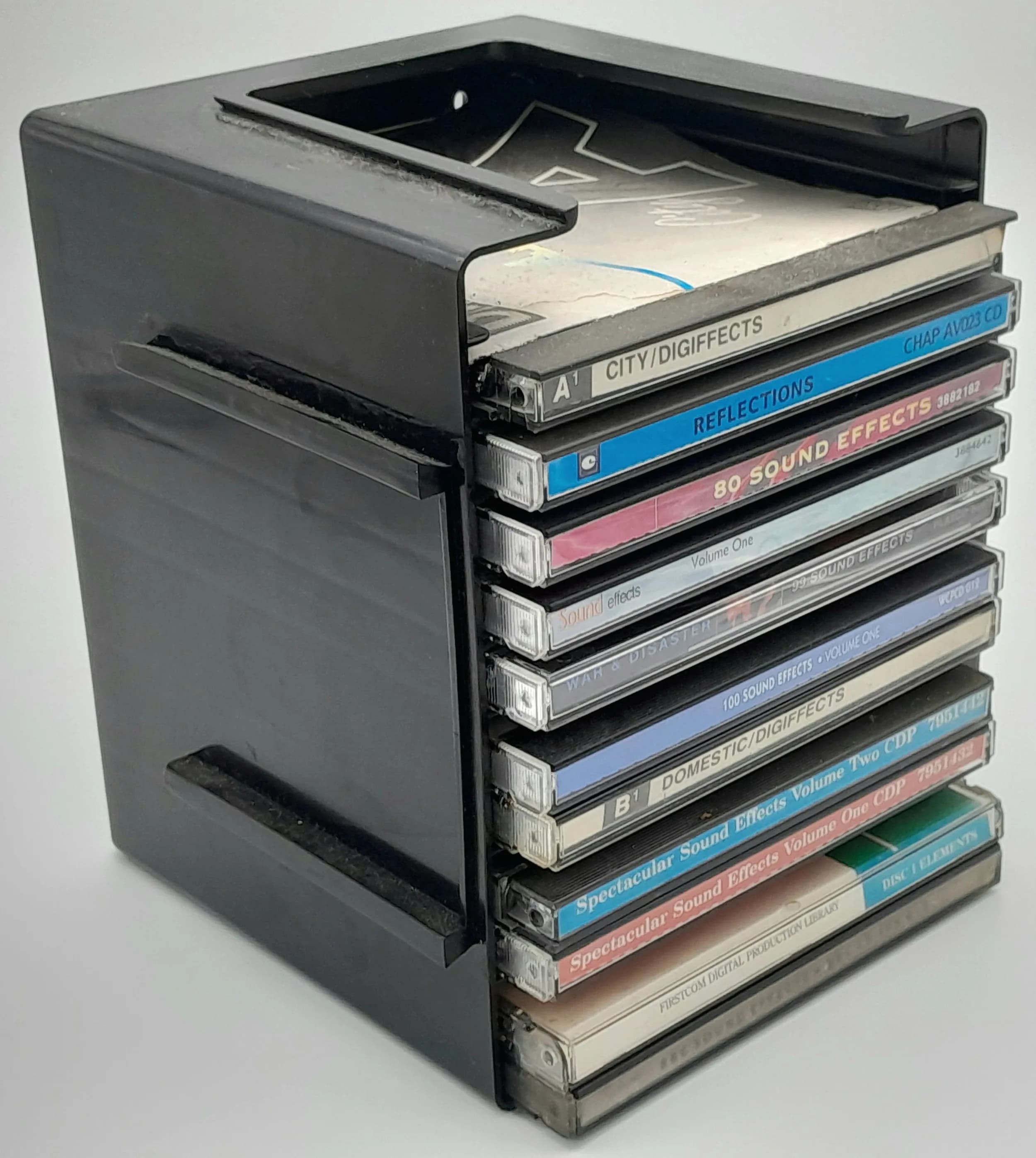A Collection of 11 Sound Effect CDs. Comes with a storage stand.