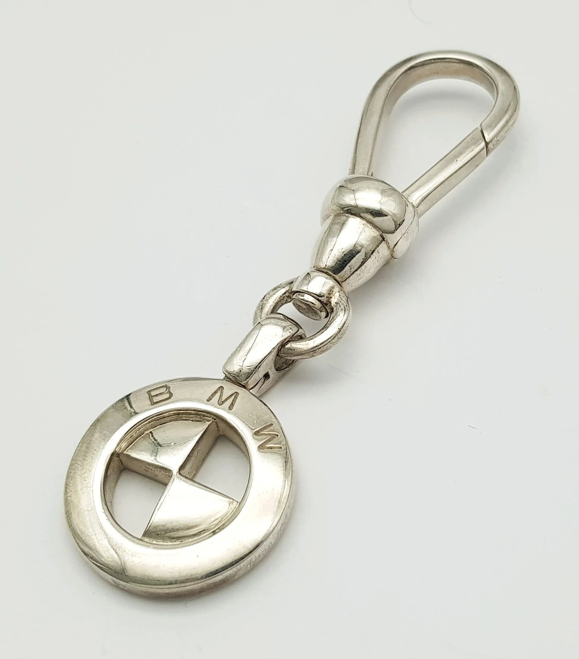 A STERLING SILVER, BMW CAR MANUFACTURER'S KEYRING. 49.4G. 8427