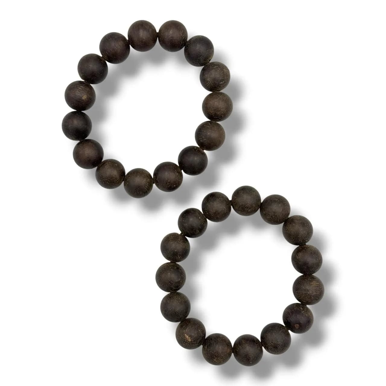 A Pair of natural Agarwood Bead prayer Bracelets.The natural agarwood fragrance is well known for its purposes in relaxation and meditation.Dark brown agarwood spherical beads strung on elastic cords. Good condition with light surface wear. Approximately 15 round beads per bracelet. Please see photos or request a condition report.This item is held at Cadmore ASIAN Office in Vietnam and will be shipped from there. Buyers will be responsible for direct shipping payments. Delivery will take slightly longer.