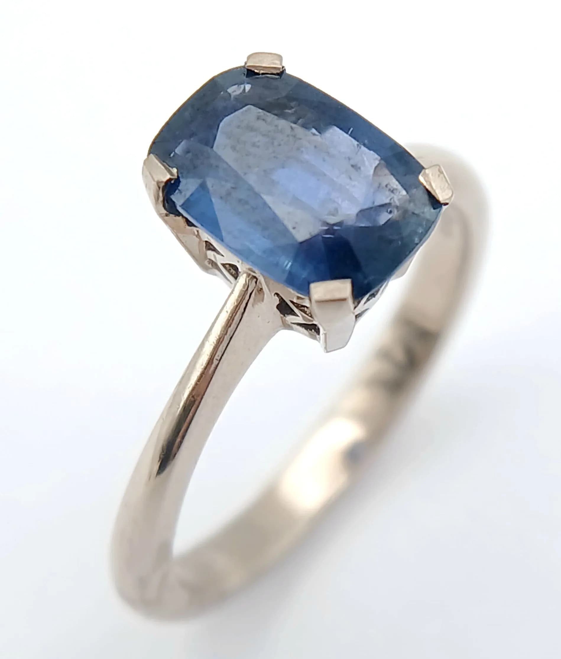 An 18K White Gold and Sapphire Solitaire Ring. A 1.75ct emerald cut sapphire. Size M. 3.9g total weight. NL15/73106.