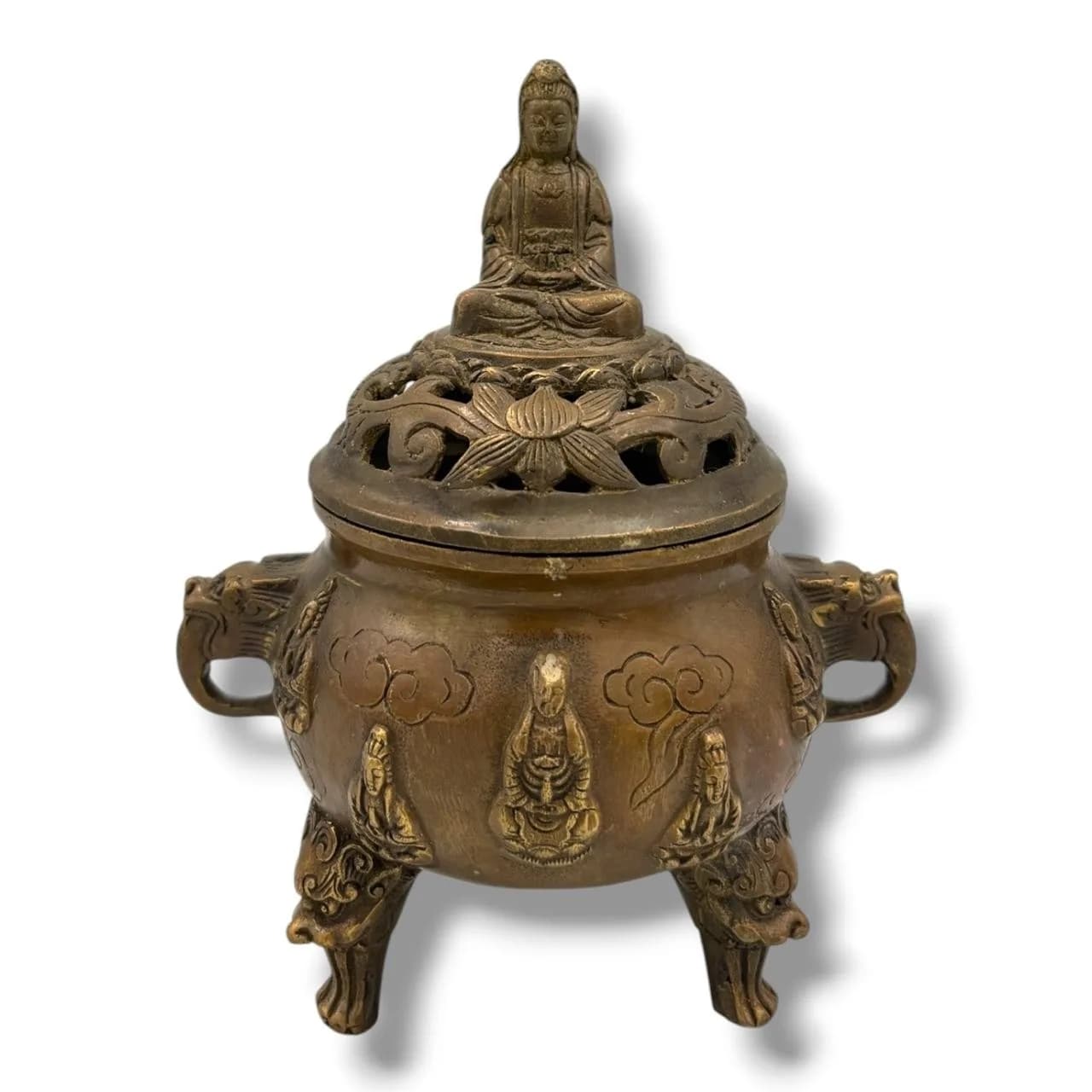 An antique Asian Bronze Tripod Incense Burner and Cover. The rounded censer is raised on three mask-form legs and fitted with a pair of loop handles, the body cast in relief with seated figures of Guanyin beneath stylised clouds. The pierced domed cover is surmounted by a seated Buddha finial and decorated with openwork lotus scrolls, allowing the fragrance of burning incense to escape. Height 14 cm; width 11 cm. Please see photos or request a condition report.This item is held at Cadmore ASIAN Office in Vietnam and will be shipped from there. Buyers will be responsible for direct shipping payments. Delivery will take slightly longer.