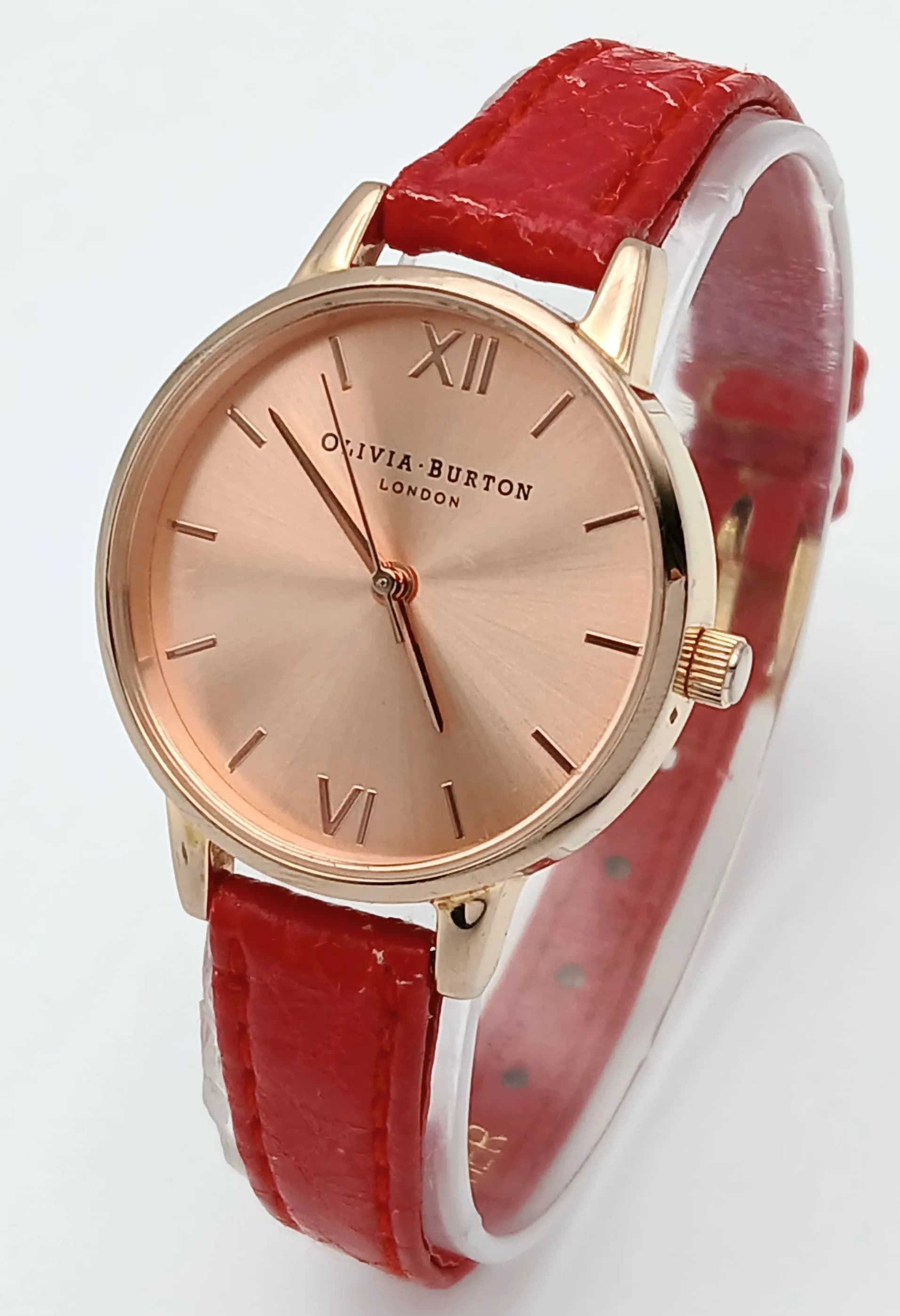 AN OLIVIA BURTON, RED LEATHER STRAP WATCH. IN FULL WORKING ORDER. S/A 1705