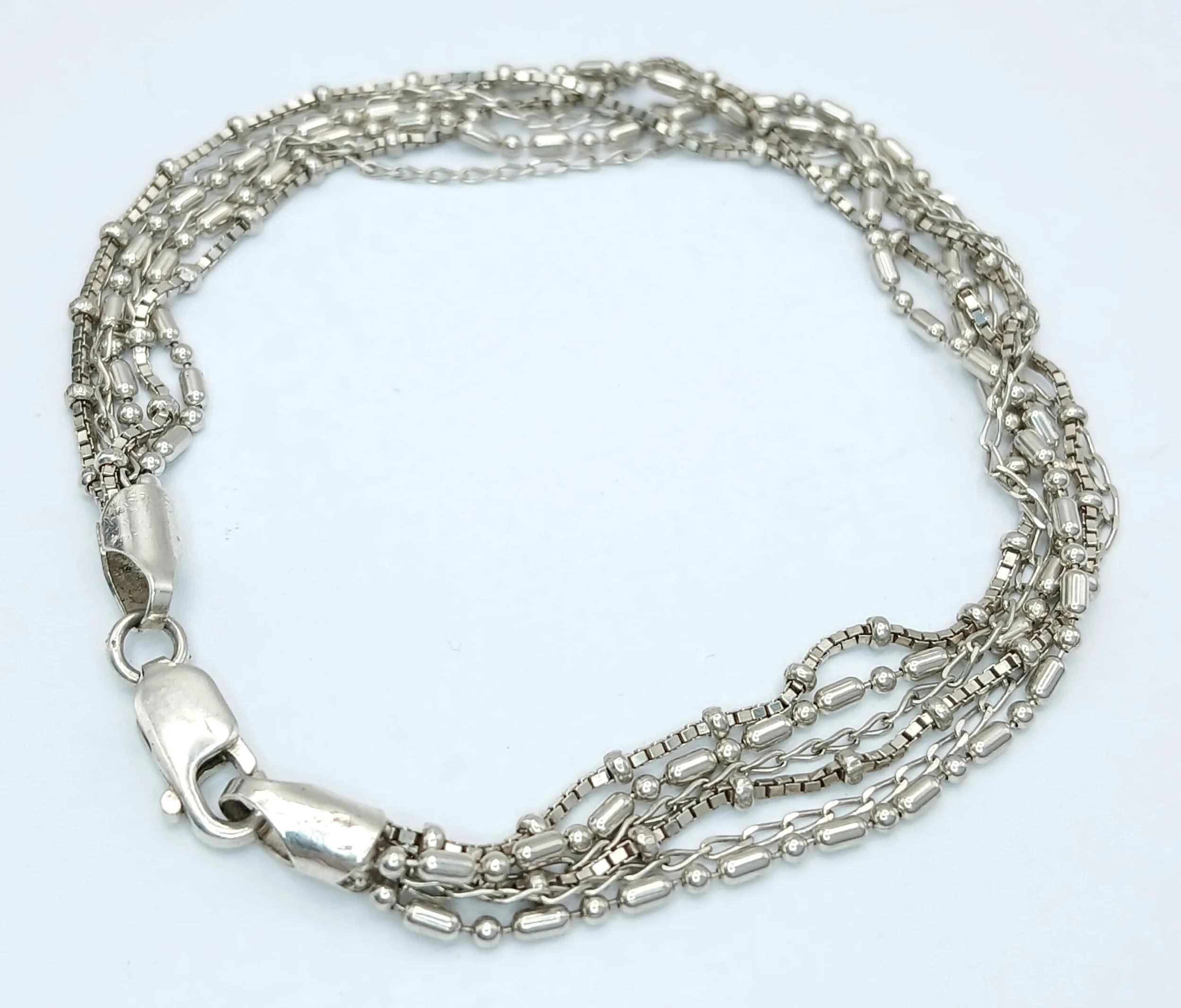 A STERLING SILVER, MULTI ROW, FANCY LINK BRACELET. 7 1/2". 6.9G. CHALK 6001