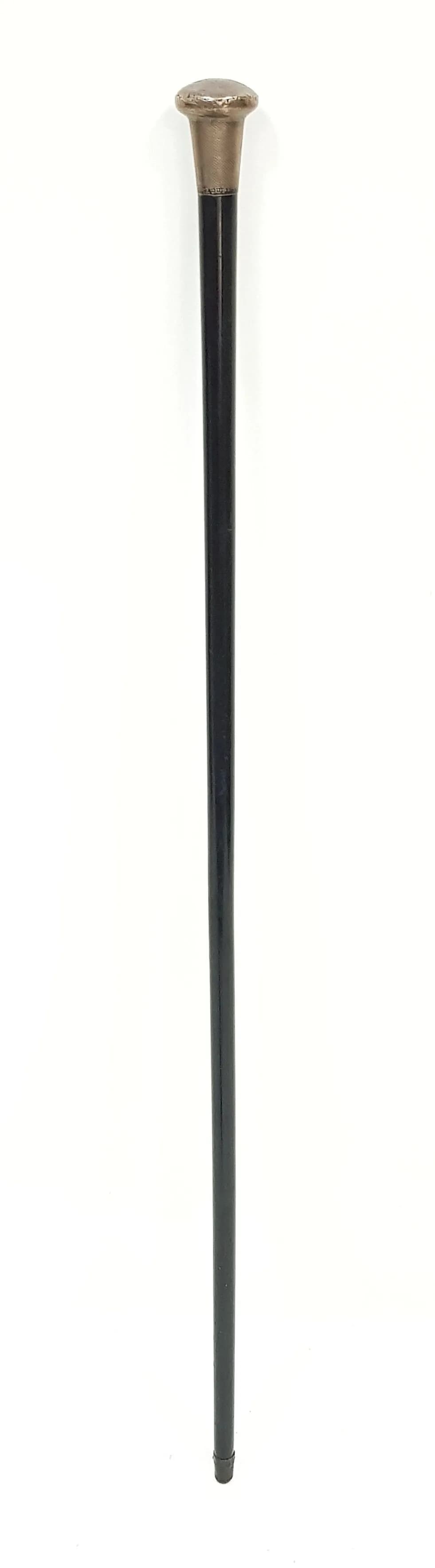 An Antique Walking Cane with Sterling Silver Pommel Top and Ebonised Wood Shaft. Hallmarks for London 1922. Makers mark of Hall and Fitzgerald. 94cm length.