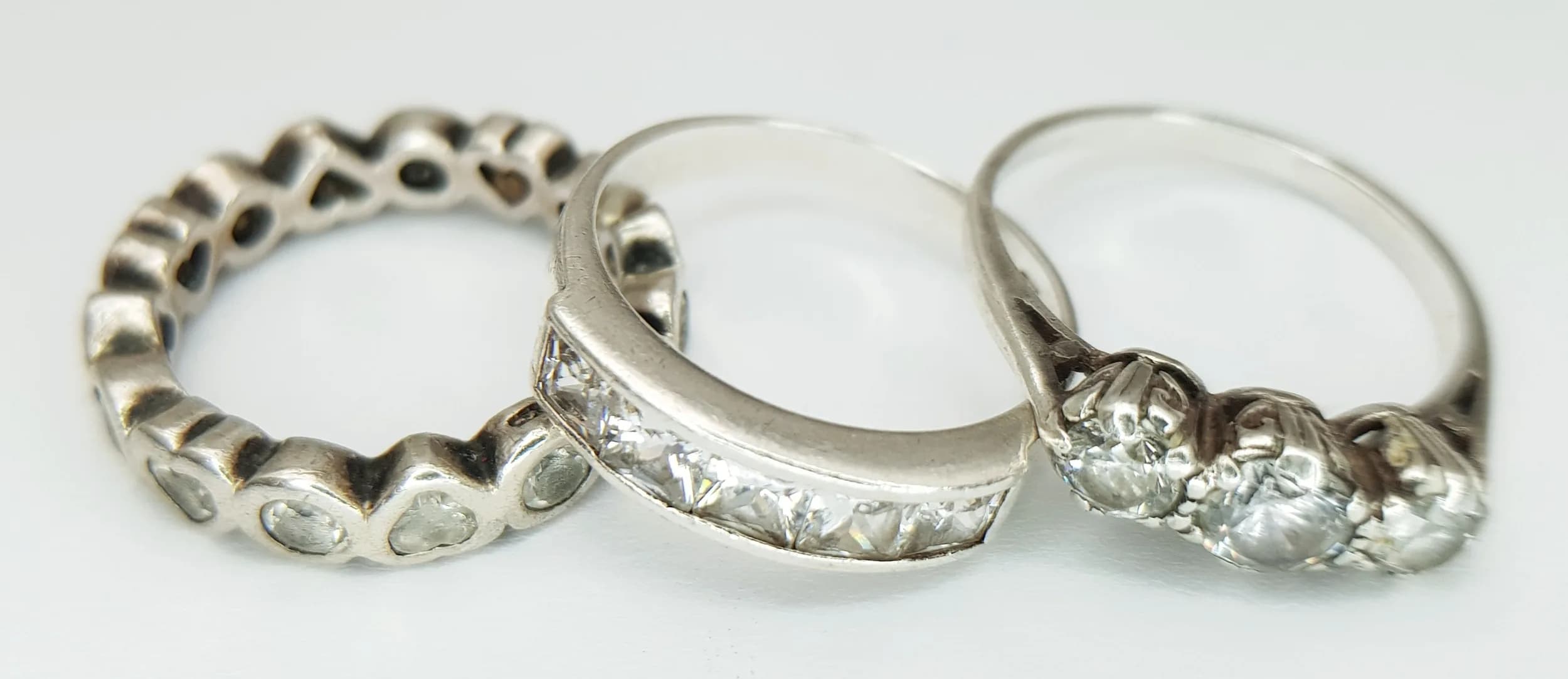 A TRIO OF STERLING SILVER, STONE SET RINGS. SIZES L, N AND O. 9.2G. TREV SIL 6006