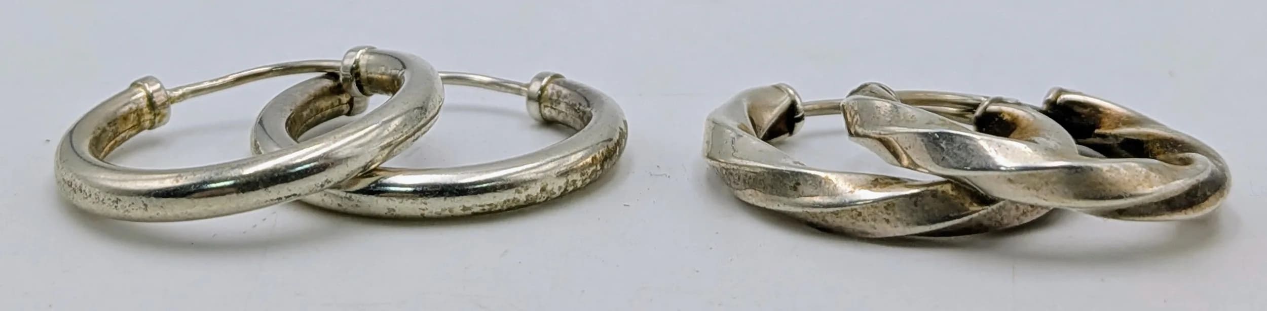 Two Pairs of Silver Hoop Earrings. Twisted hoop and plain. 5.03g total weight.