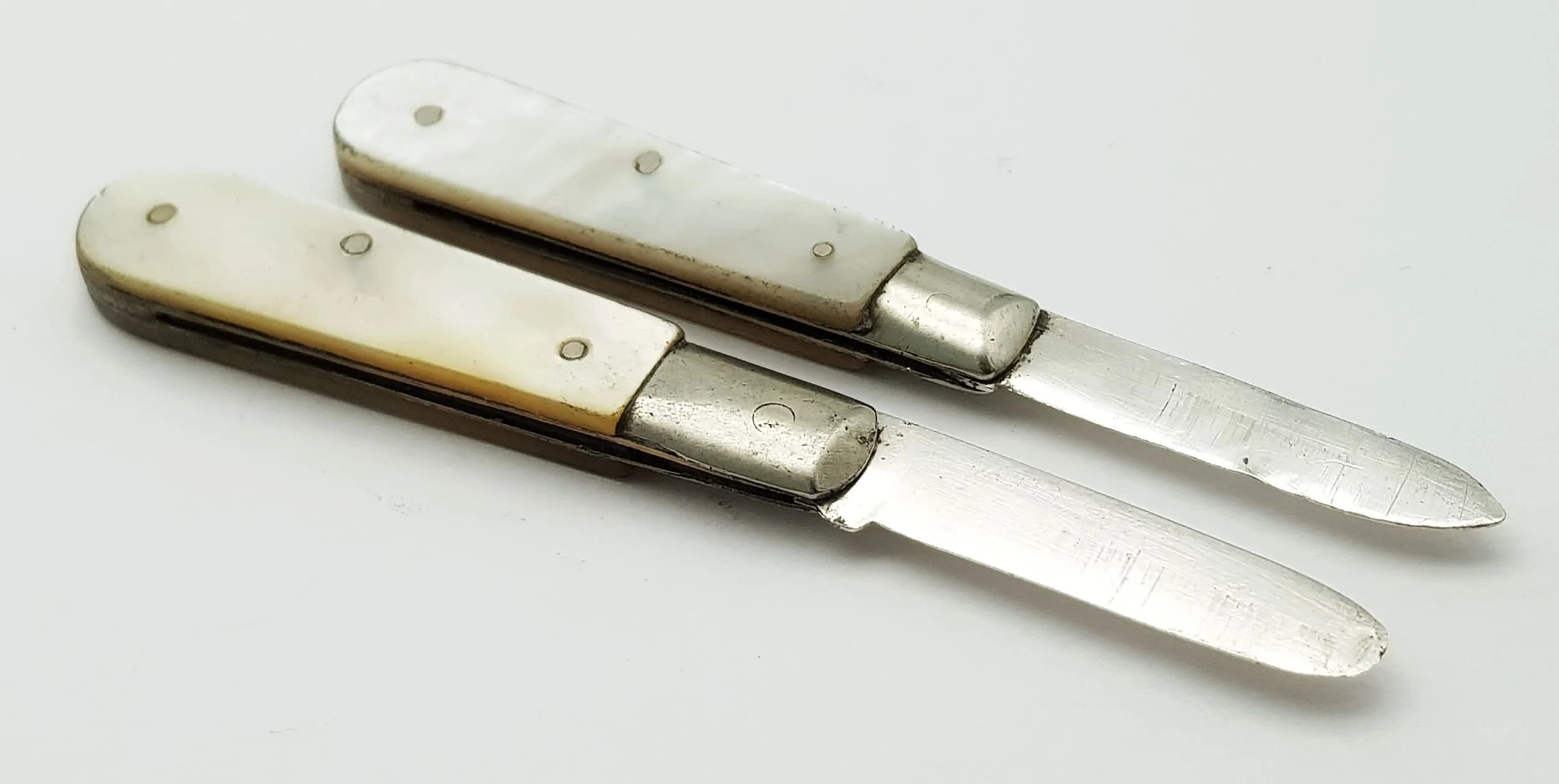 Two Antique Sterling Silver and Mother of Pearl Small Fruit Knives. Hallmarks on blade. 5cm.
