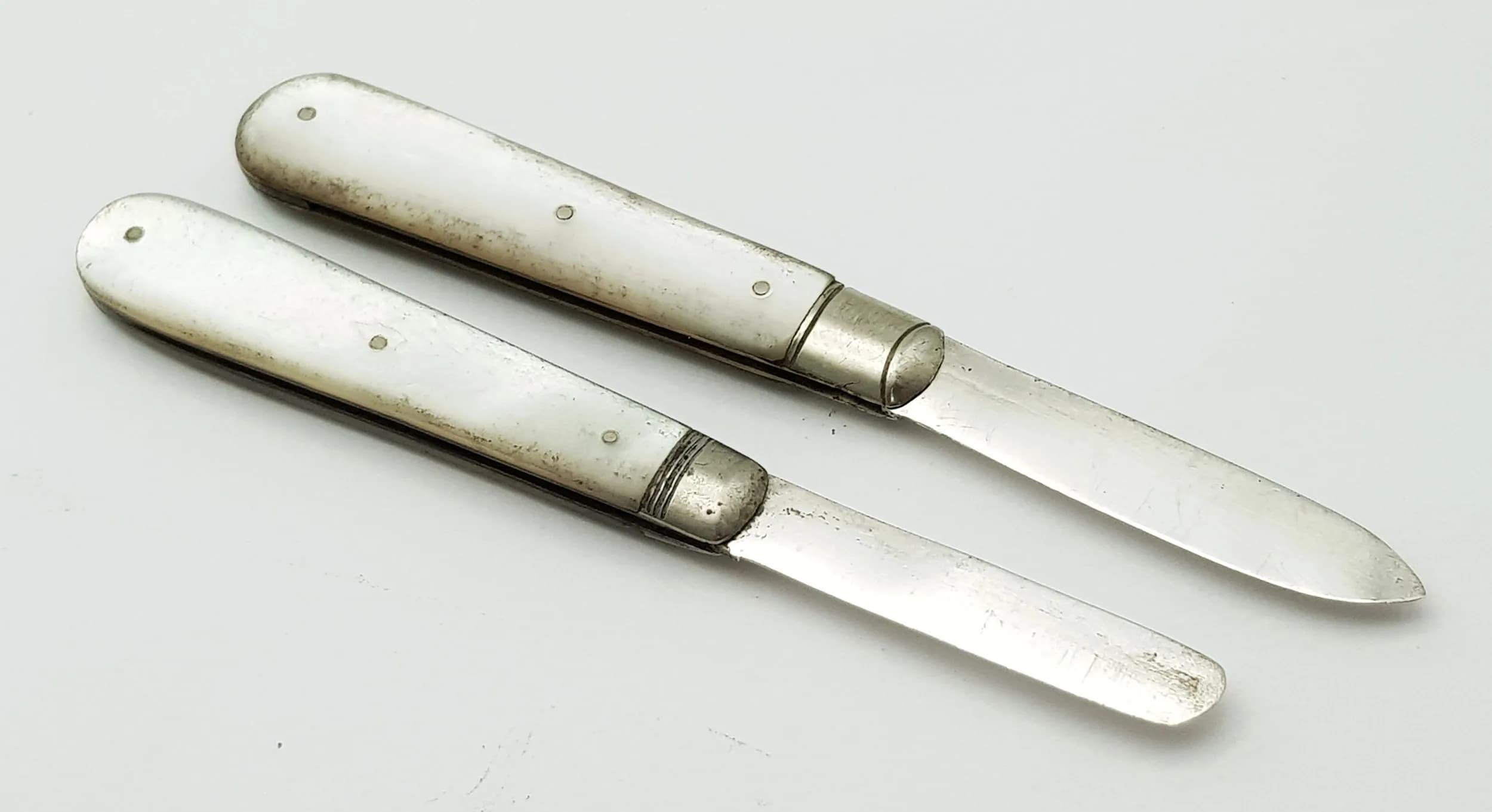 Two Antique Sterling Silver and Mother of Pearl Small Fruit Knives. Hallmarks on blade. 5.5cm.