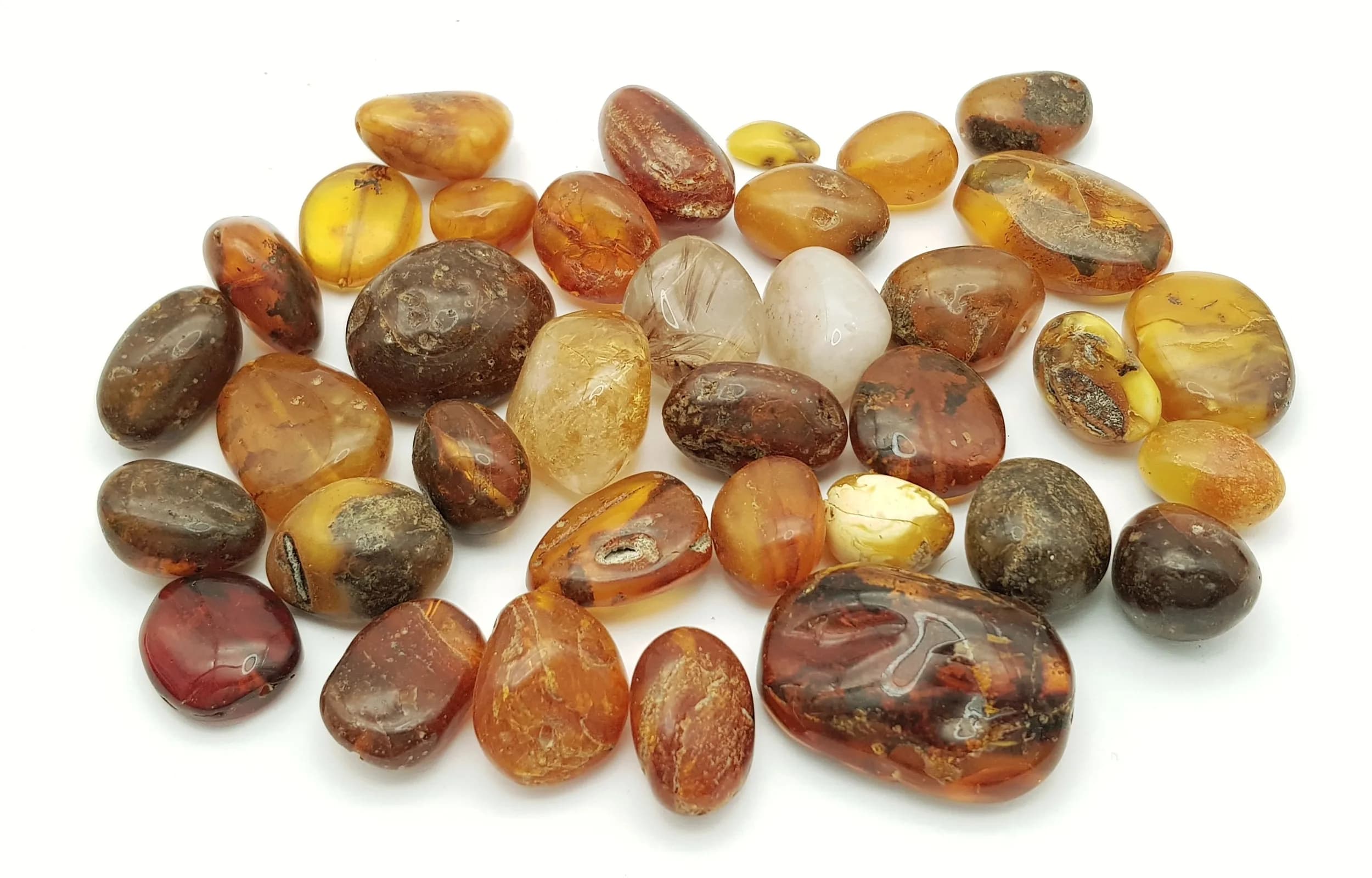 650ctw of Amber Pieces. All different colours and irregular shapes. All pieces drilled for necklace/bracelet making (if needed). 130g.
