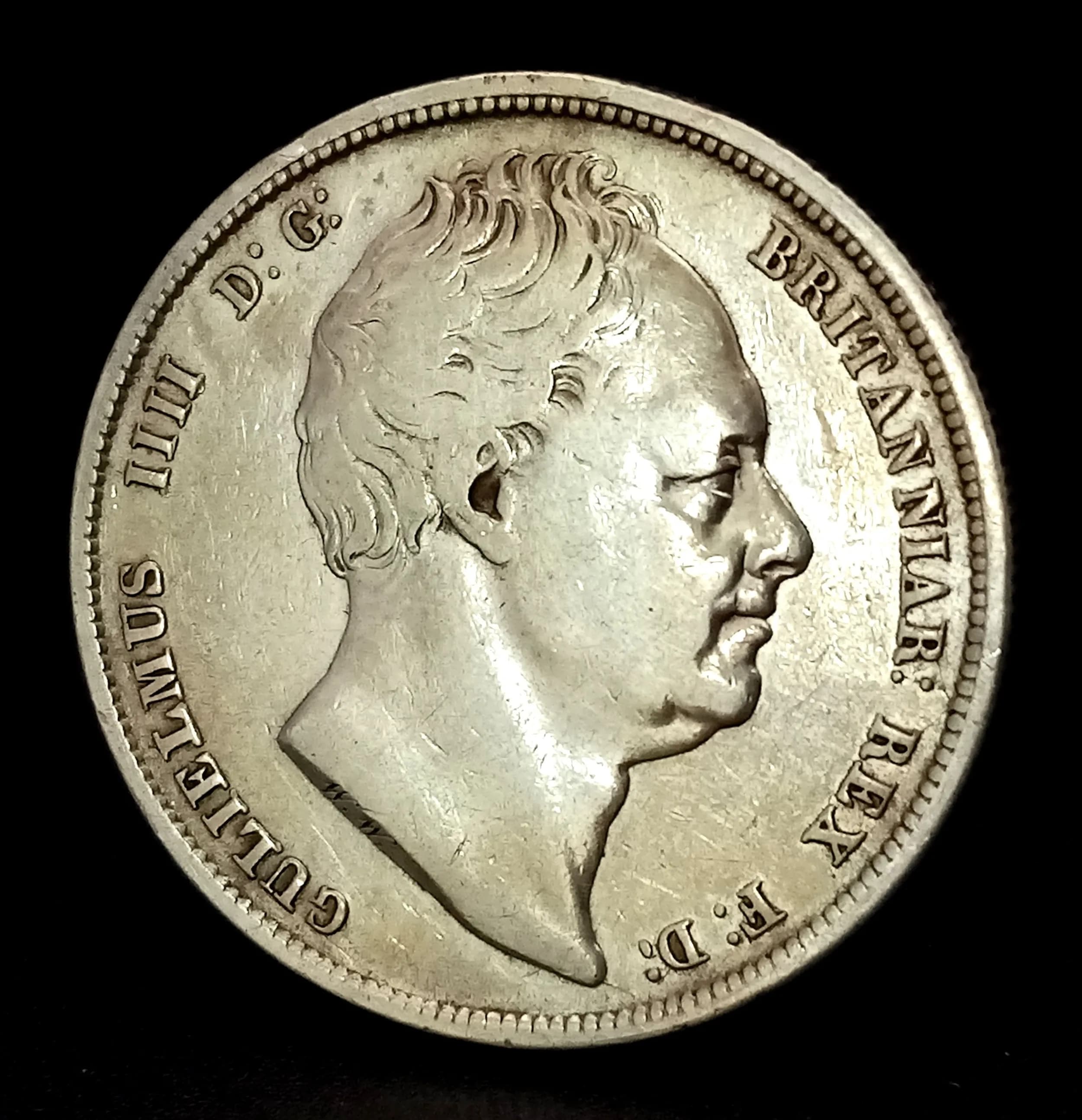 A William IV 1836 Silver Half Crown Coin. Obverse with bare head portrait of King William IV, reverse with crowned shield within mantle design. Dated 1836.