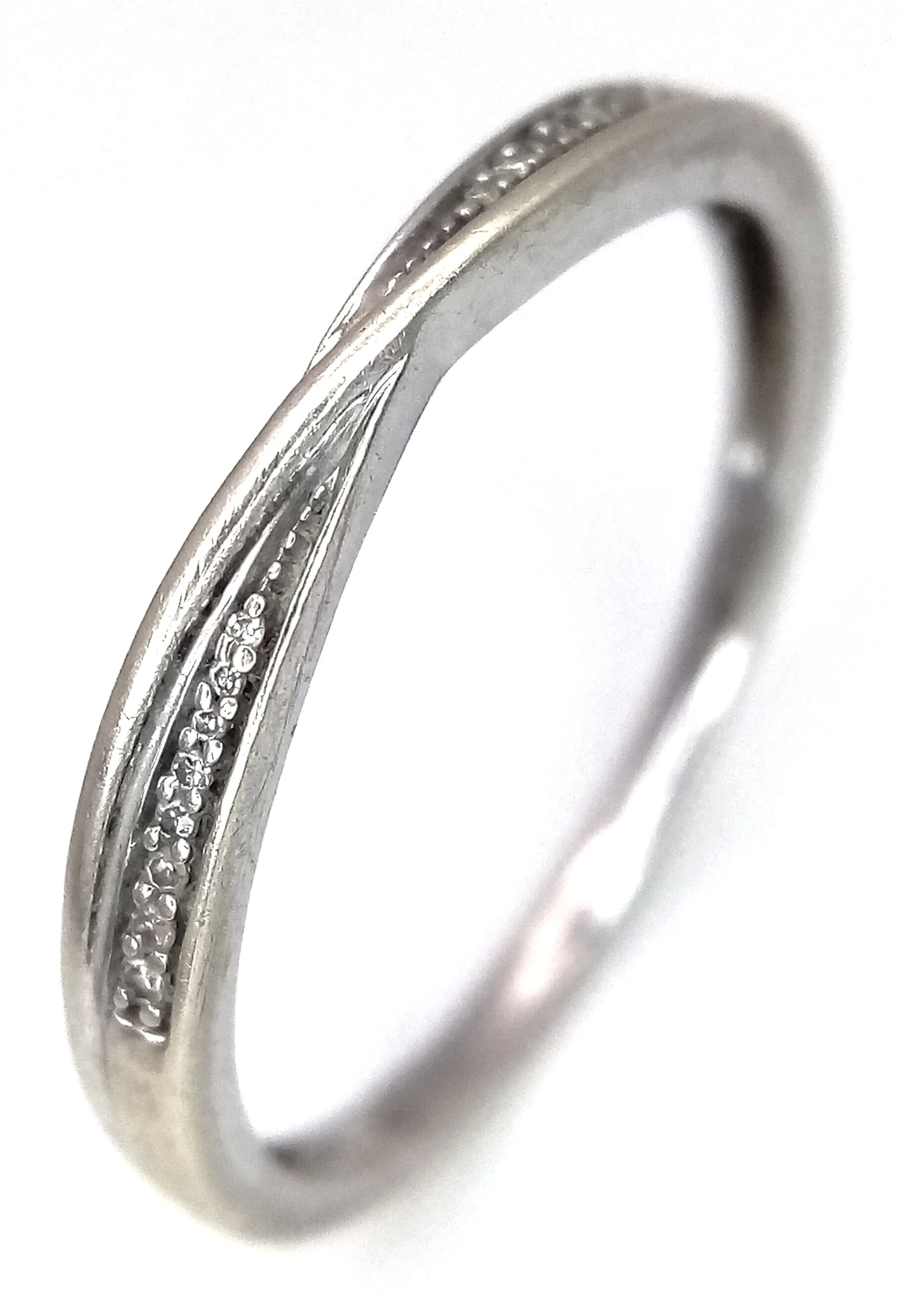 A 9K White Gold Diamond Crossover Ring. Size R 1/2. 1.7g.