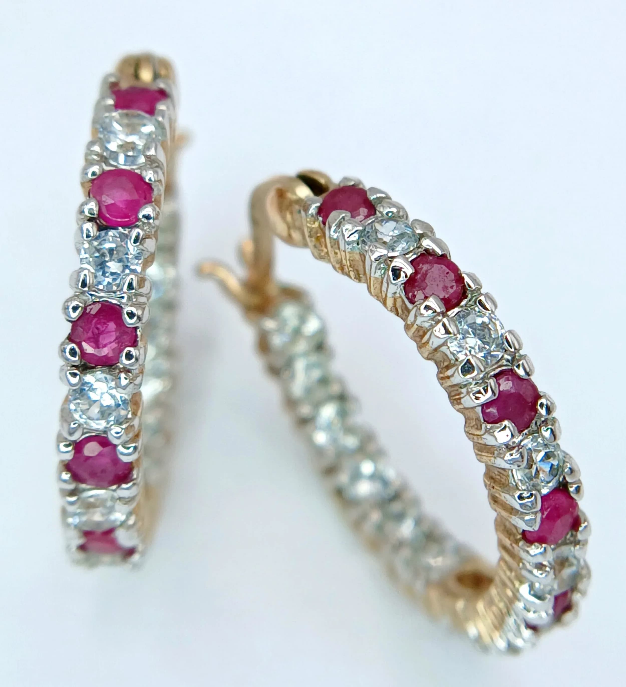A VERY PRETTY PAIR OF GOLD FILLED EARRINGS WITH PINK AND WHITE STONES . 3gms