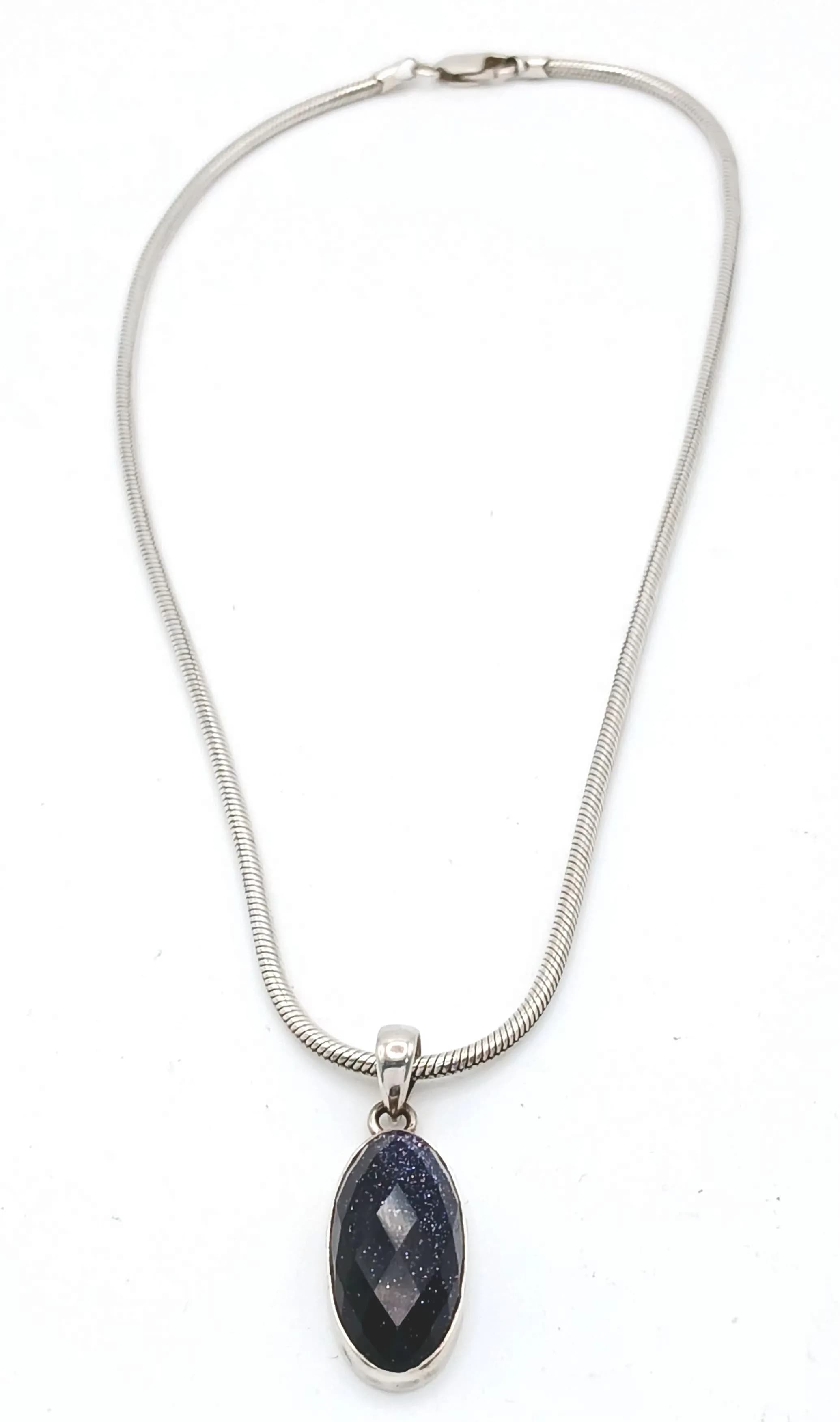 A 925 silver stone set pendant necklace. Total weight 20.1G. Total length 43cm.