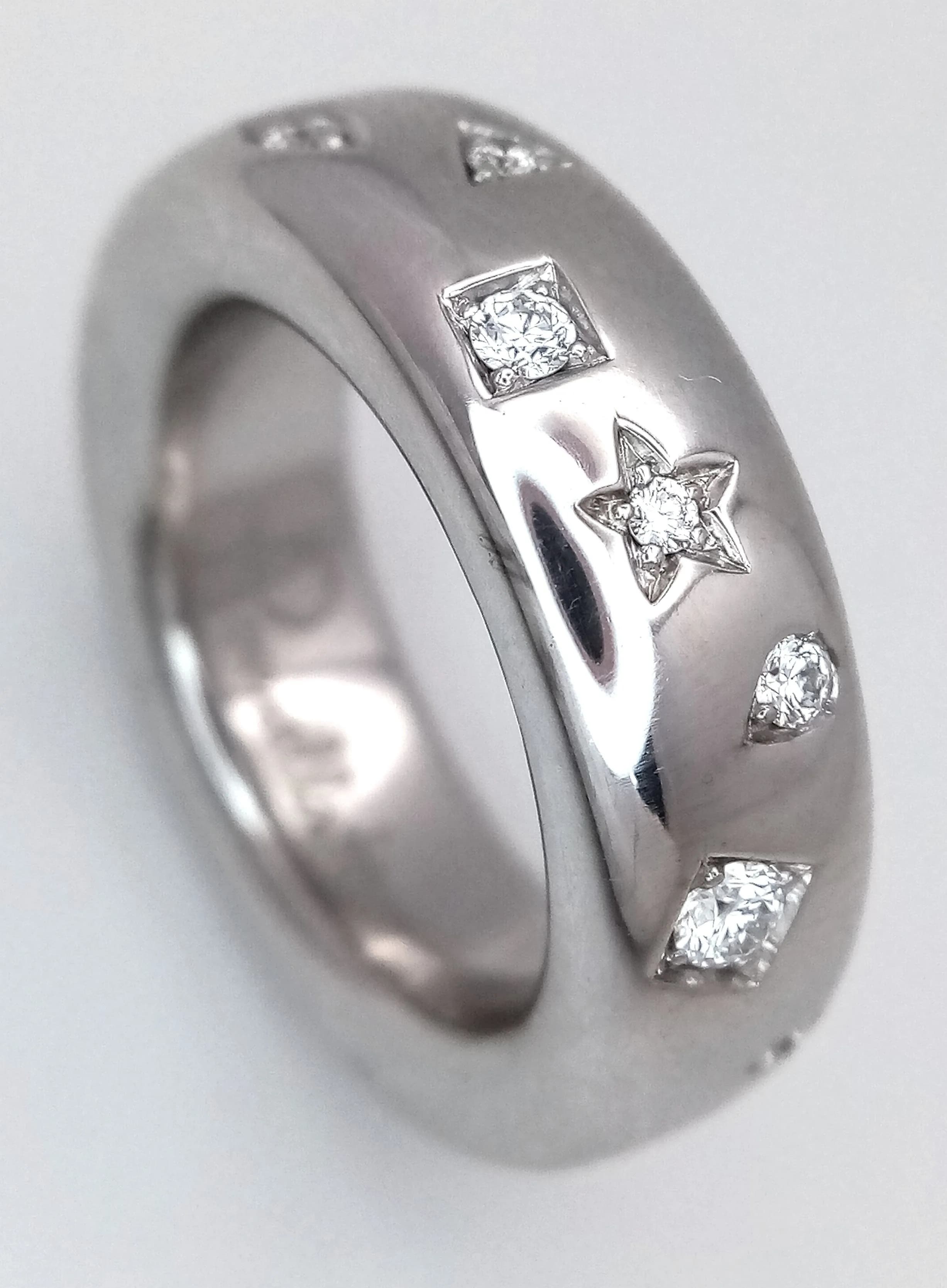 A Designer 'Pomellato' Diamond Iconica Band Ring. Different shaped deep set diamonds of 0.55ctw. Size 54 (N 1/2). 9.05g total weight. Ref: 026782.