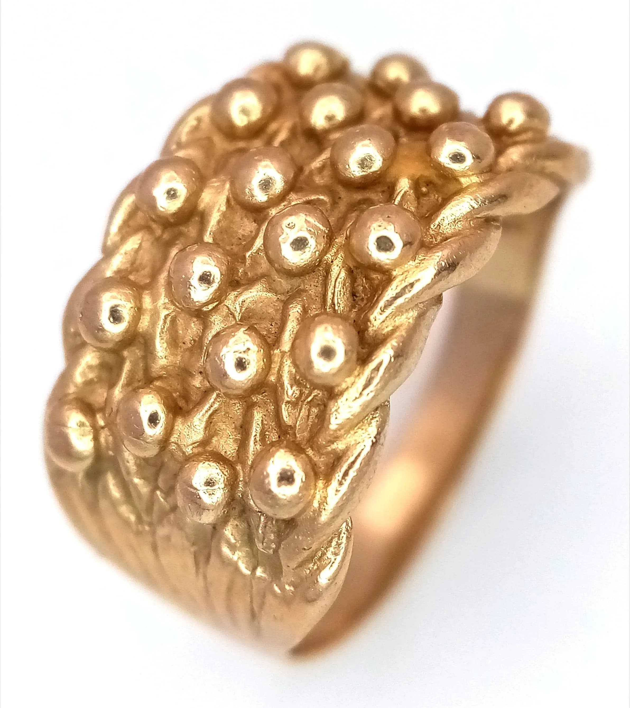 A 9K Yellow Gold Keeper Ring. 11mm widest point. Size O. 4.75g.