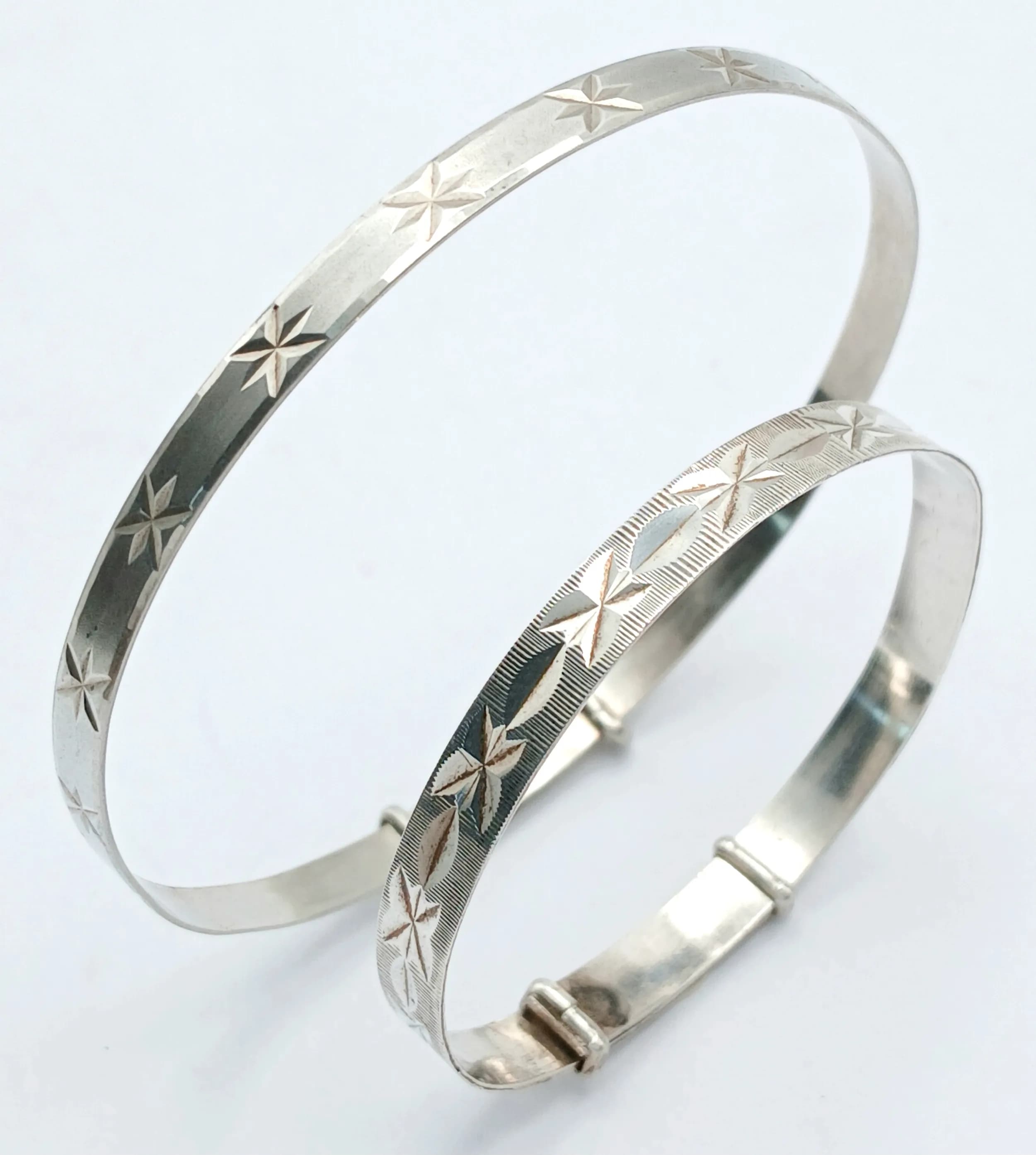 Two Vintage Sterling Silver Adjustable Bangles. Approx 6cm and 4cm diameter. Total weight: 9.49g.