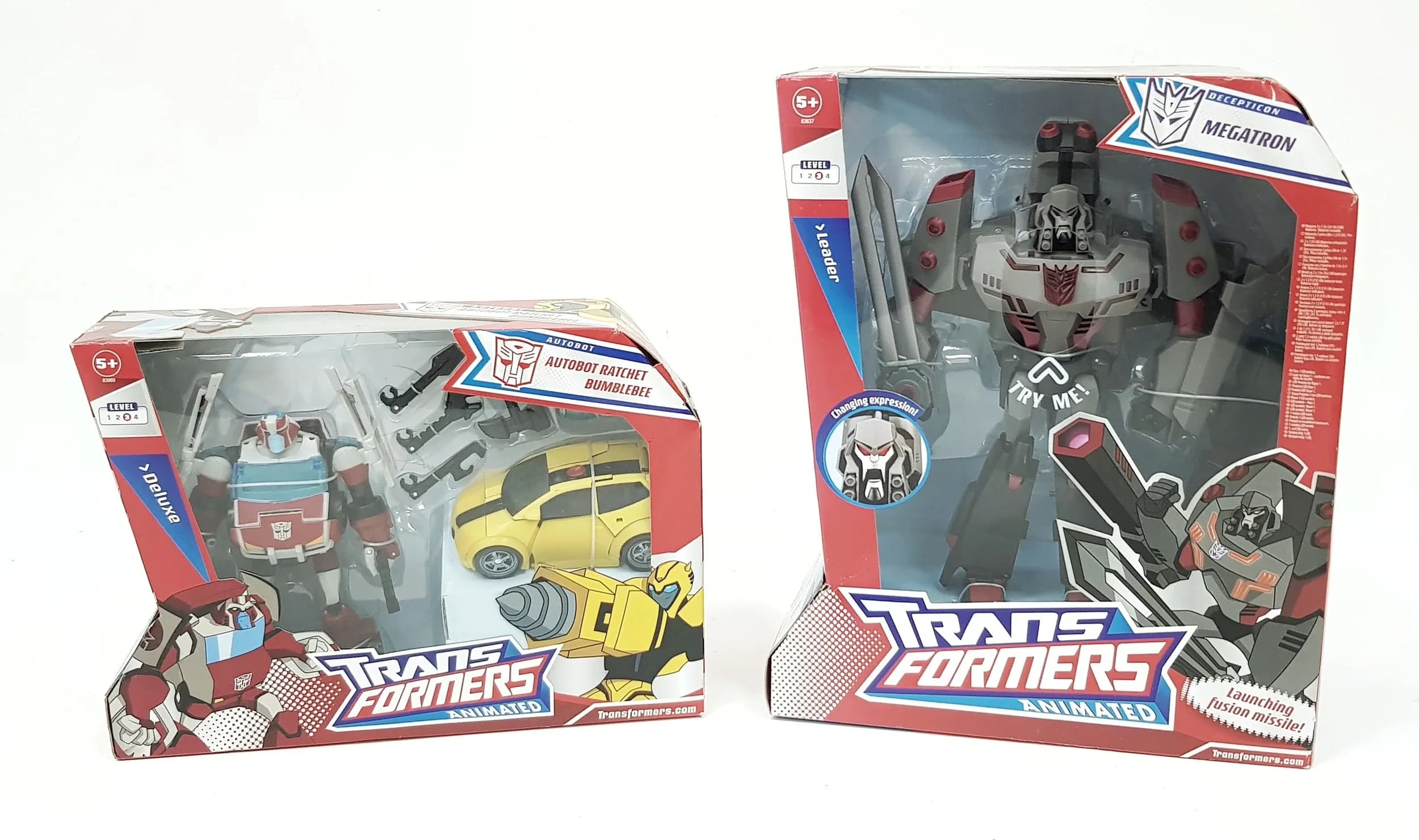 Two vintage Transformers Animated by Hasbro. Still factory sealed. Slight wear to boxes from storage, otherwise in good condition.