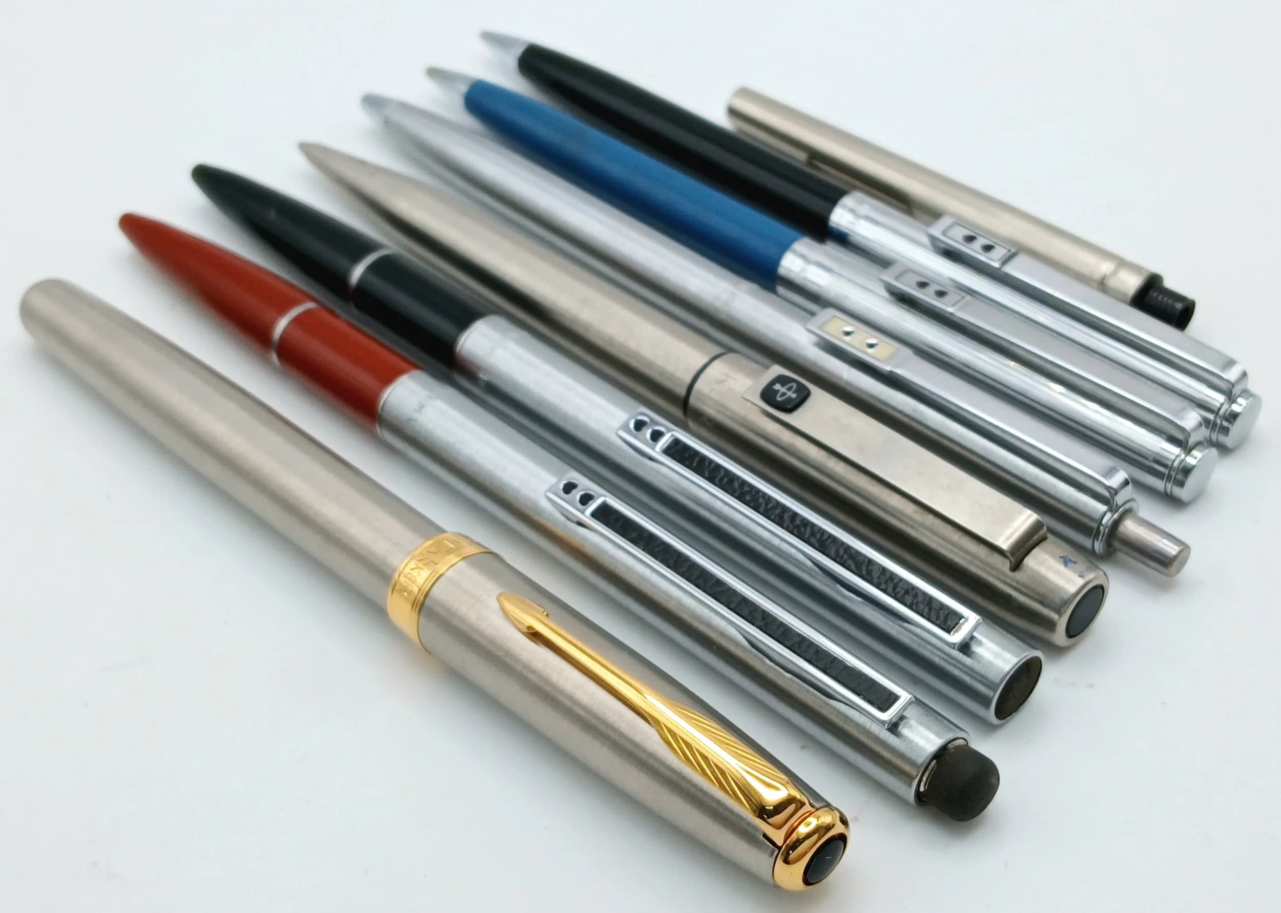 A Parcel of Seven Parker Pens and One Parker Ink Cartridge/Refill Comprising Various Ballpoint and Fountain Pens. To include stainless steel and mixed colour examples, including brushed steel, black, red and blue finishes. Please see photos for details.