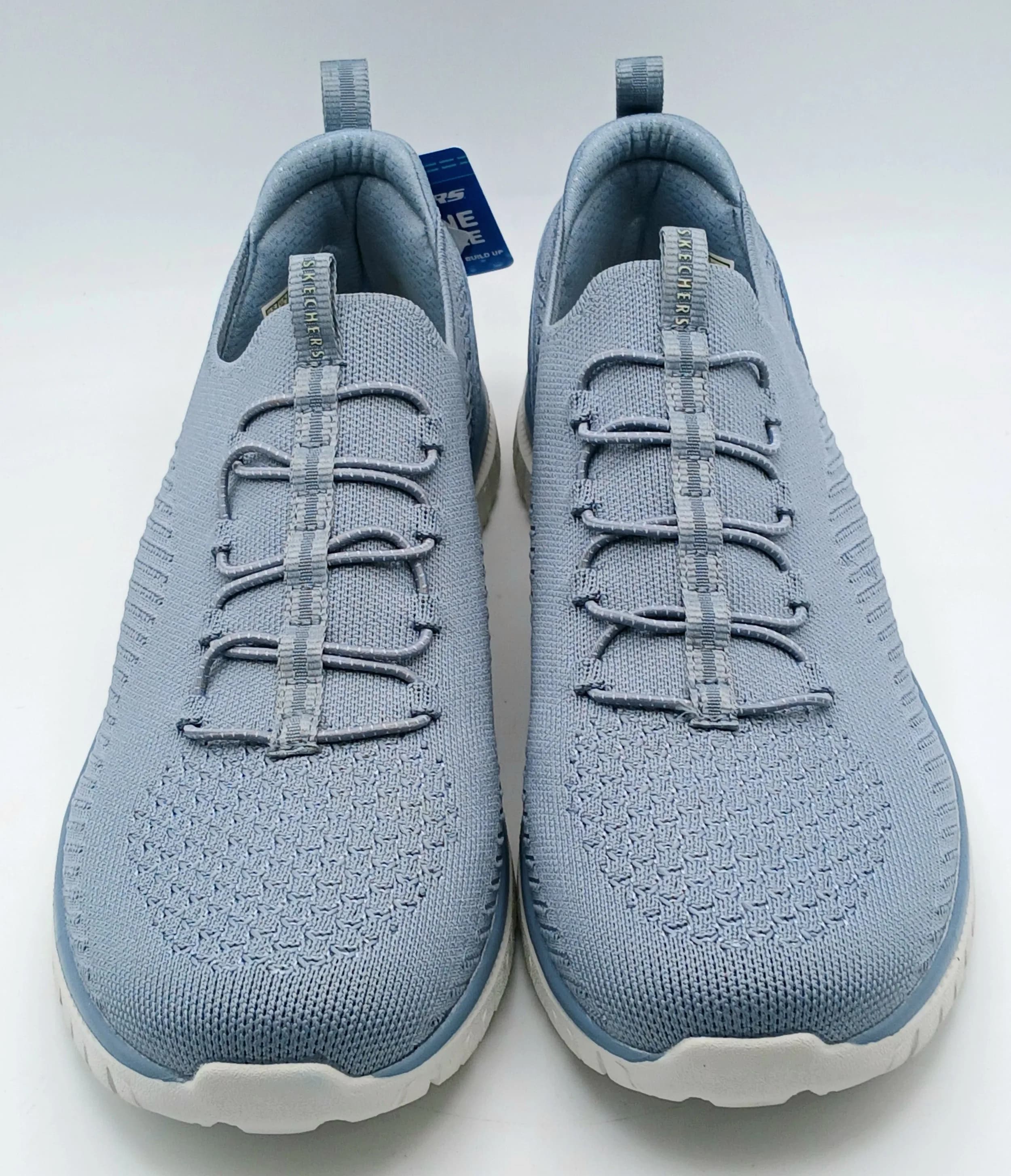A pair of light blue Sketchers slip-ins featuring Arch Fit technology. New with tags, UK size 7, US size 7