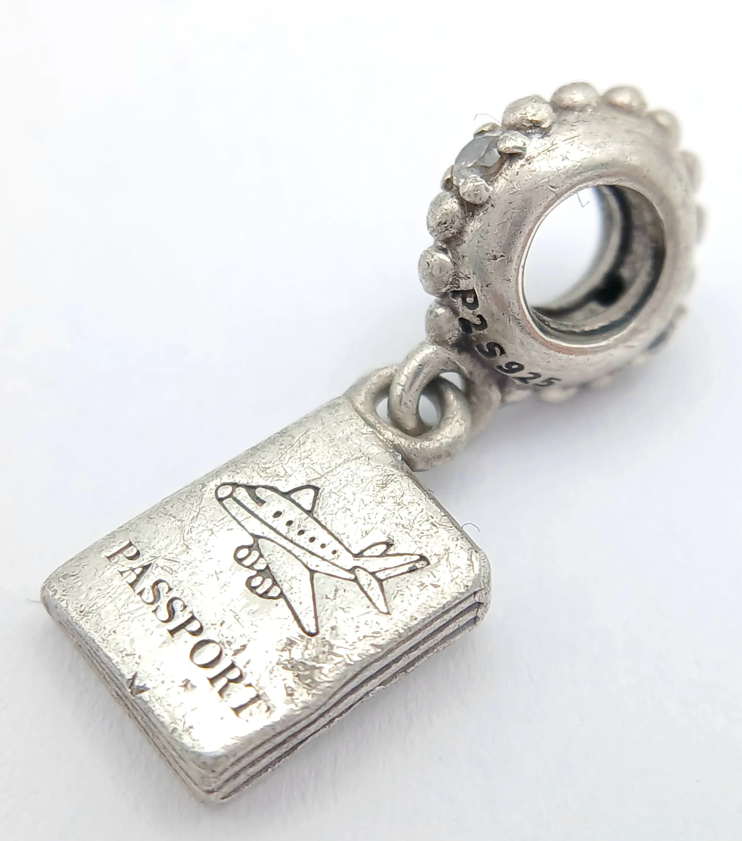 A PANDORA, STERLING SILVER, TRAVEL PASSPORT, DANGLE CHARM. 3G. 8290