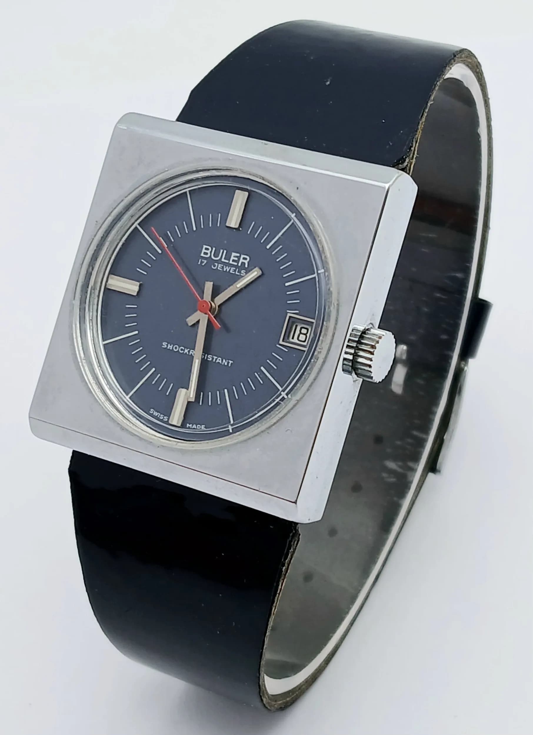 Rare VINTAGE BULER WRISTWATCH. Model 13198 22455. Having Large Square Stainless Steel Case with Blue Face. Sweeping Red Second Hand with date window. Manual winding. Full working order with exceptional movement. Excellent condition ,Please see pictures .