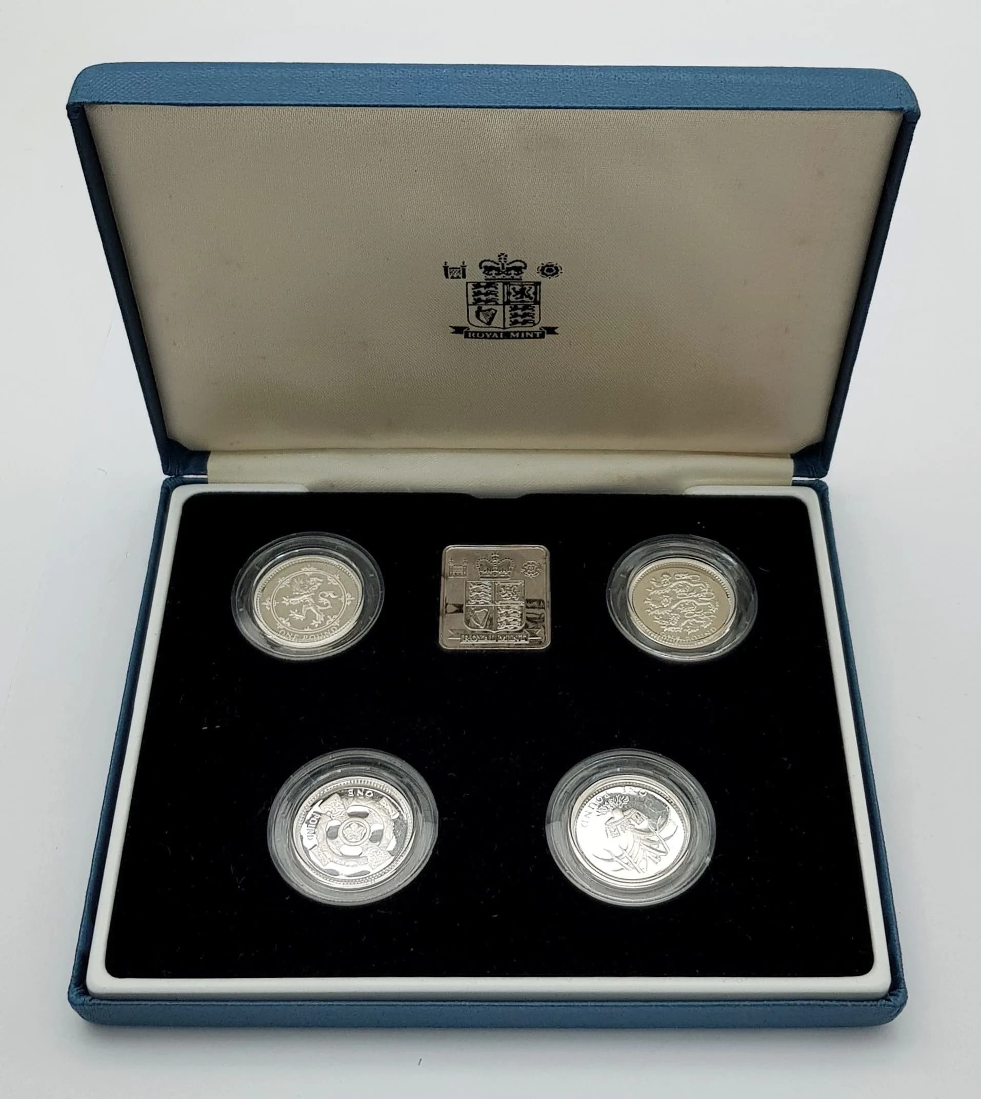 Royal Mint Limited Edition set of 4 x SILVER POUND COINS. Having designs representing England, Scotland , Northern Ireland, and Wales. Complete with original case and Certificate of Authenticity. Condition new and uncirculated .Please see pictures.