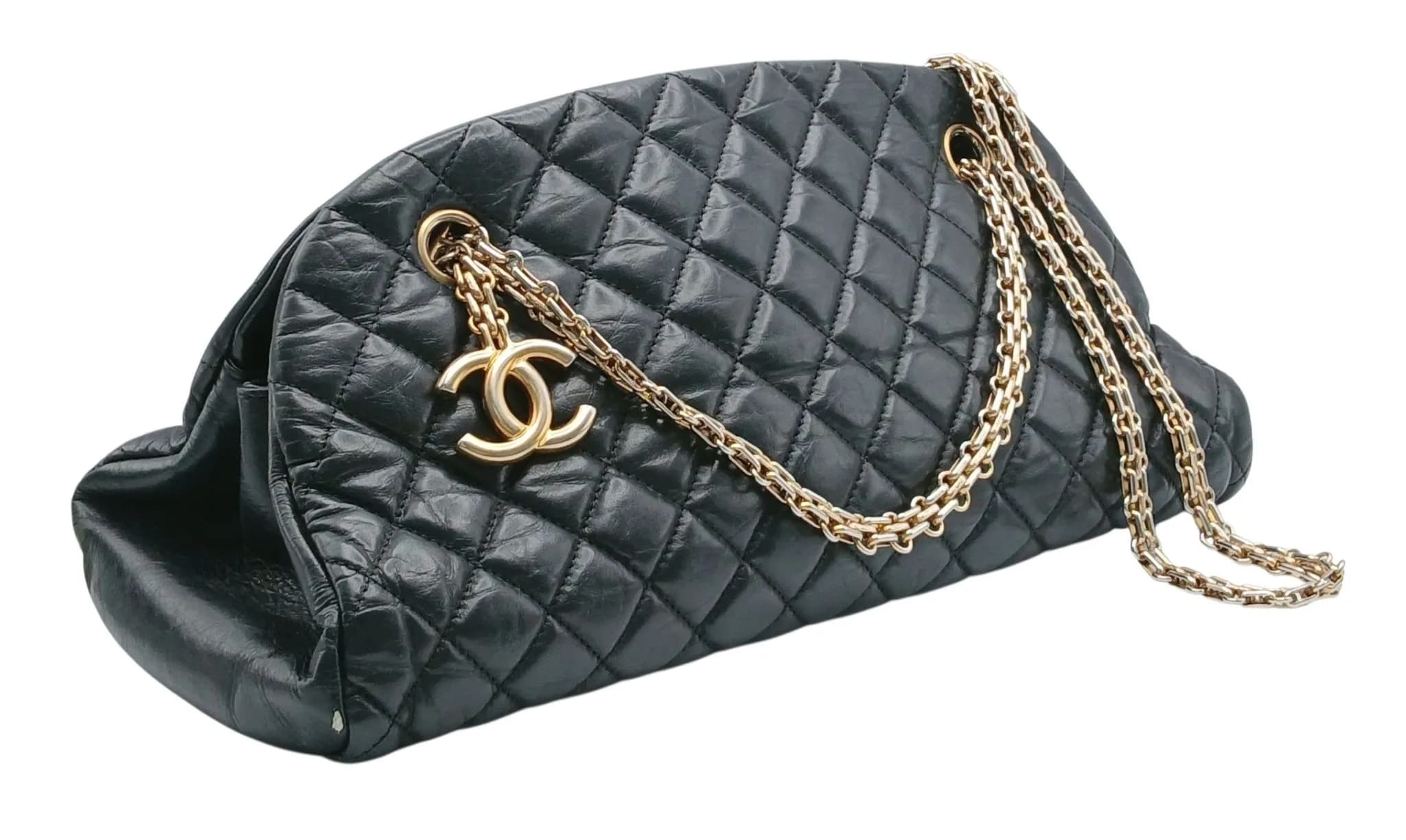 A Chanel Mademoiselle Bowling Bag. Black diamond-quilted leather exterior with gold-tone hardware, double chain shoulder straps and CC logo charm. Opens to a burgundy textile interior with two main compartments, a central zipped compartment and zipped inner side pocket. Approx. 34cm length x 16cm height. Comes with certificate of authenticity. Light creasing to the exterior leather - Please see photos or request a condition report. Ref: 29814.