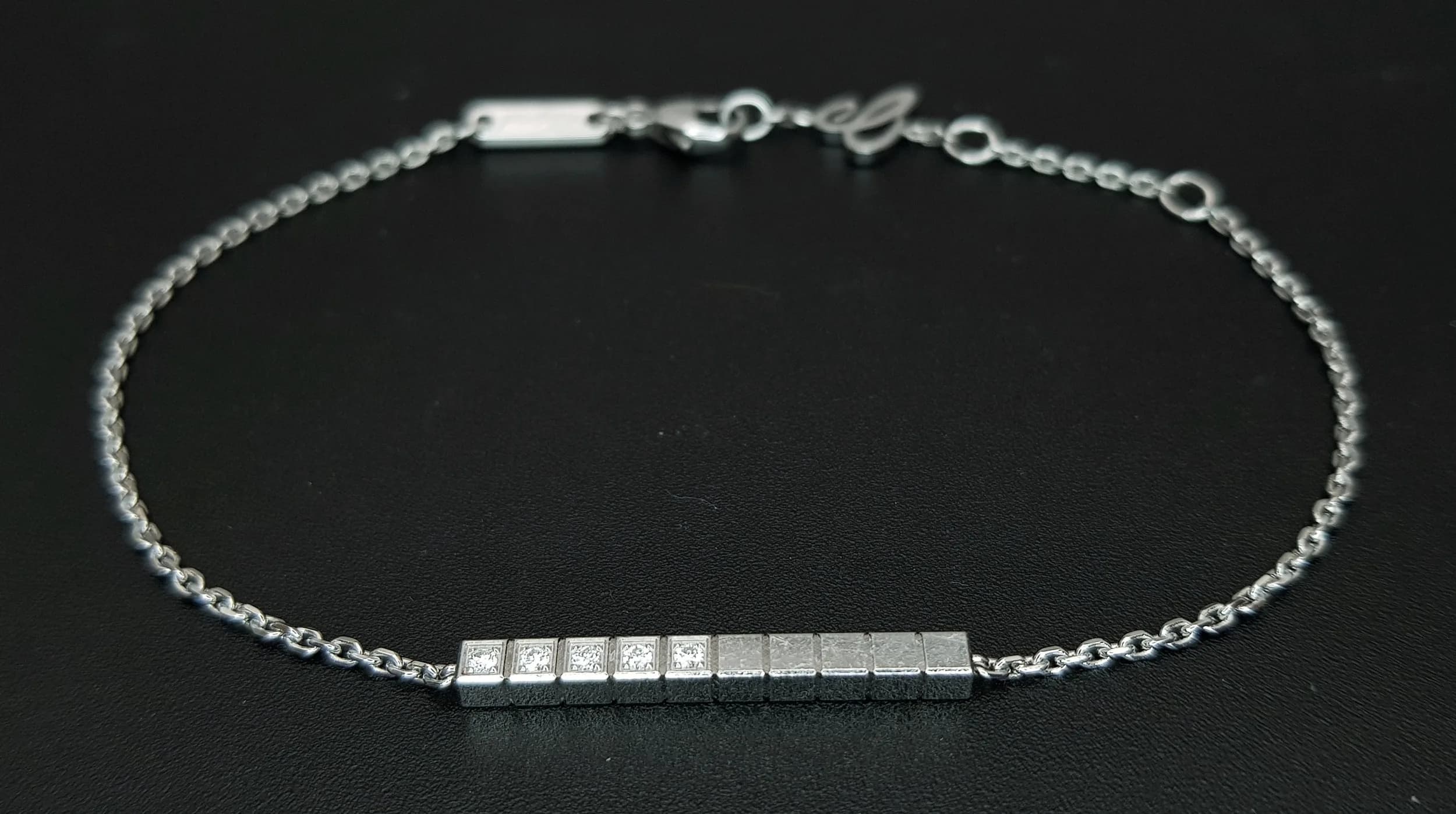 A Beautiful Chopard 18K White Gold and Diamond Bracelet. 0.10ct round brilliant cut diamonds set in square links. 18cm.4.65g total weight. Comes with original Chopard box. Ref: 029835.
