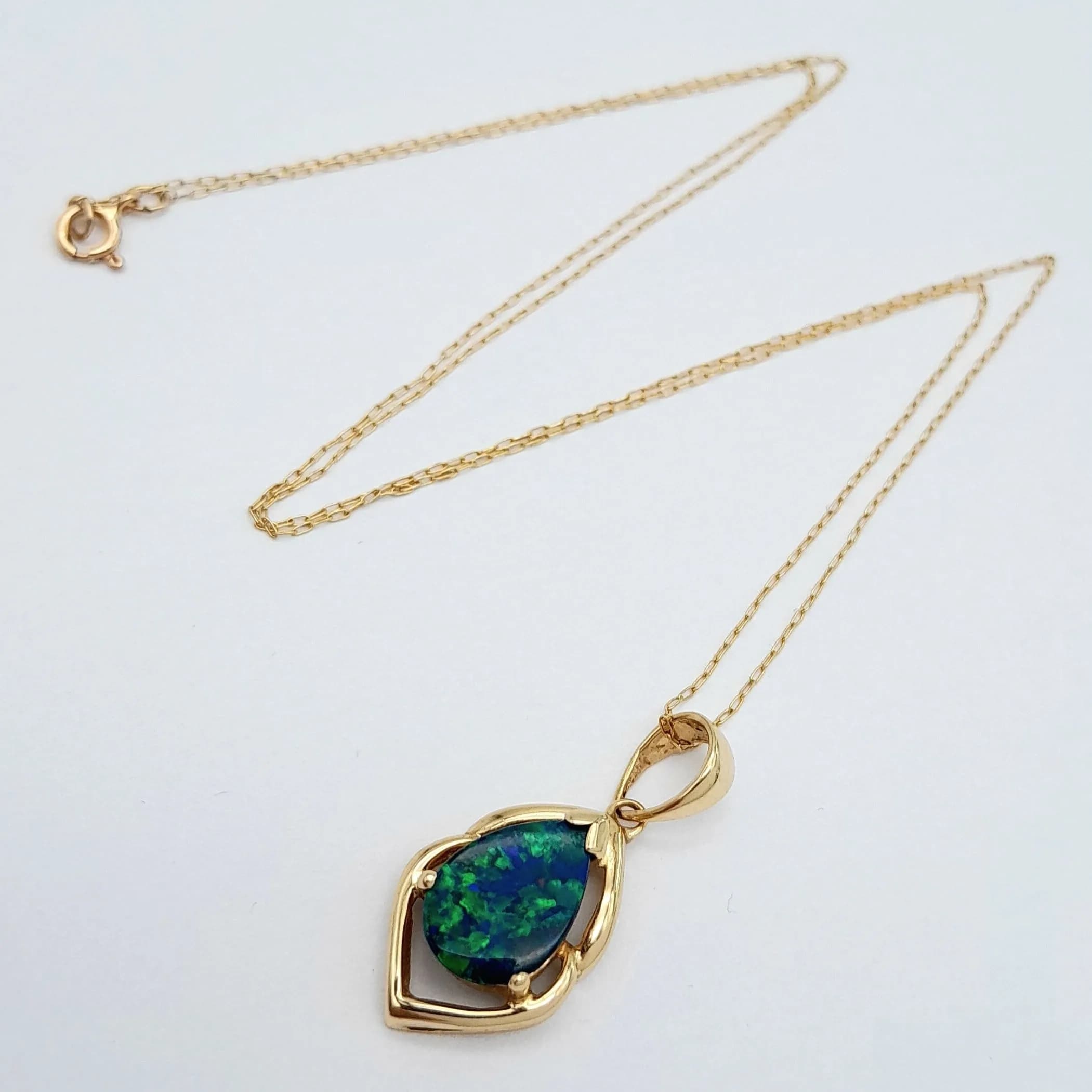 A Wonderful 14k Yellow Gold Opal Pendant Necklace-41cm Length Chain. The Pendant measures a 2.2cm drop, 1.2cm wide. Set with a 10 x 7mm Tear Drop Cut Blue and Green Opal. Gross weight 1.58 grams.
