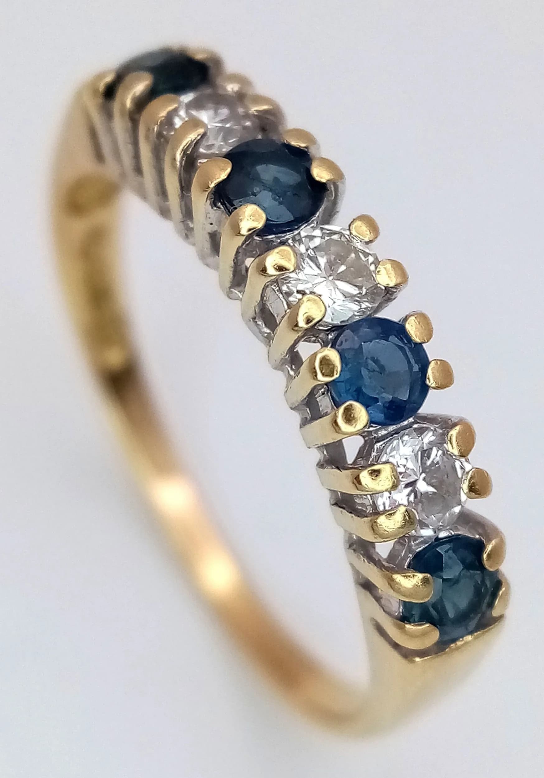 AN 18K YELLOW GOLD, DIAMOND AND SAPPHIRE SET, HALF ETERNITY RING. 2.2G, SIZE L/M. SC 7053