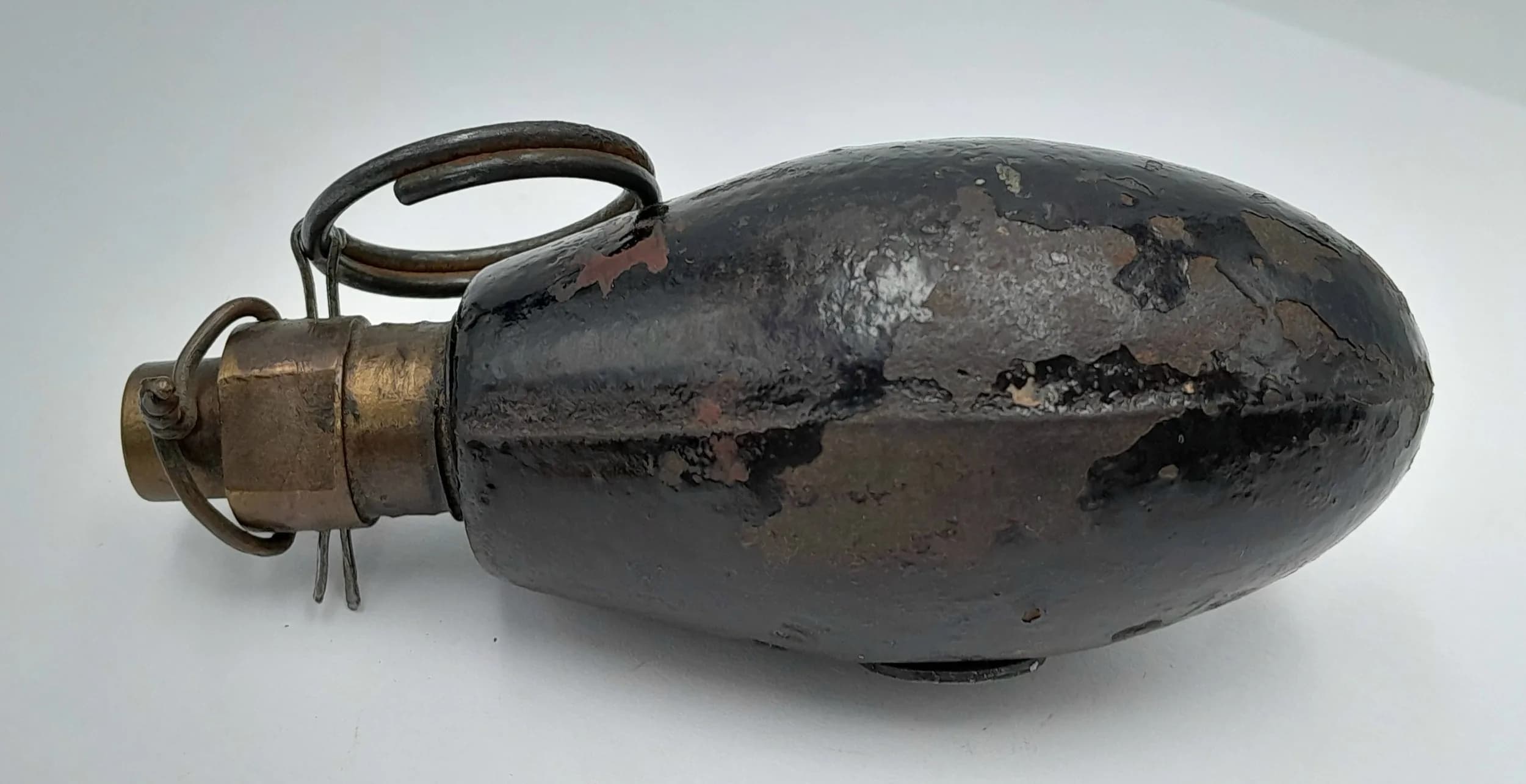 INERT WW1 British No. 34 Hand Grenade, widely known as the "egg grenade," was introduced in late 1917 as a lightweight response to German *Eierhandgranate* trench weapons. These grenades were better suited for close quarters trench warfare. UK Mainland Shipping Only.
