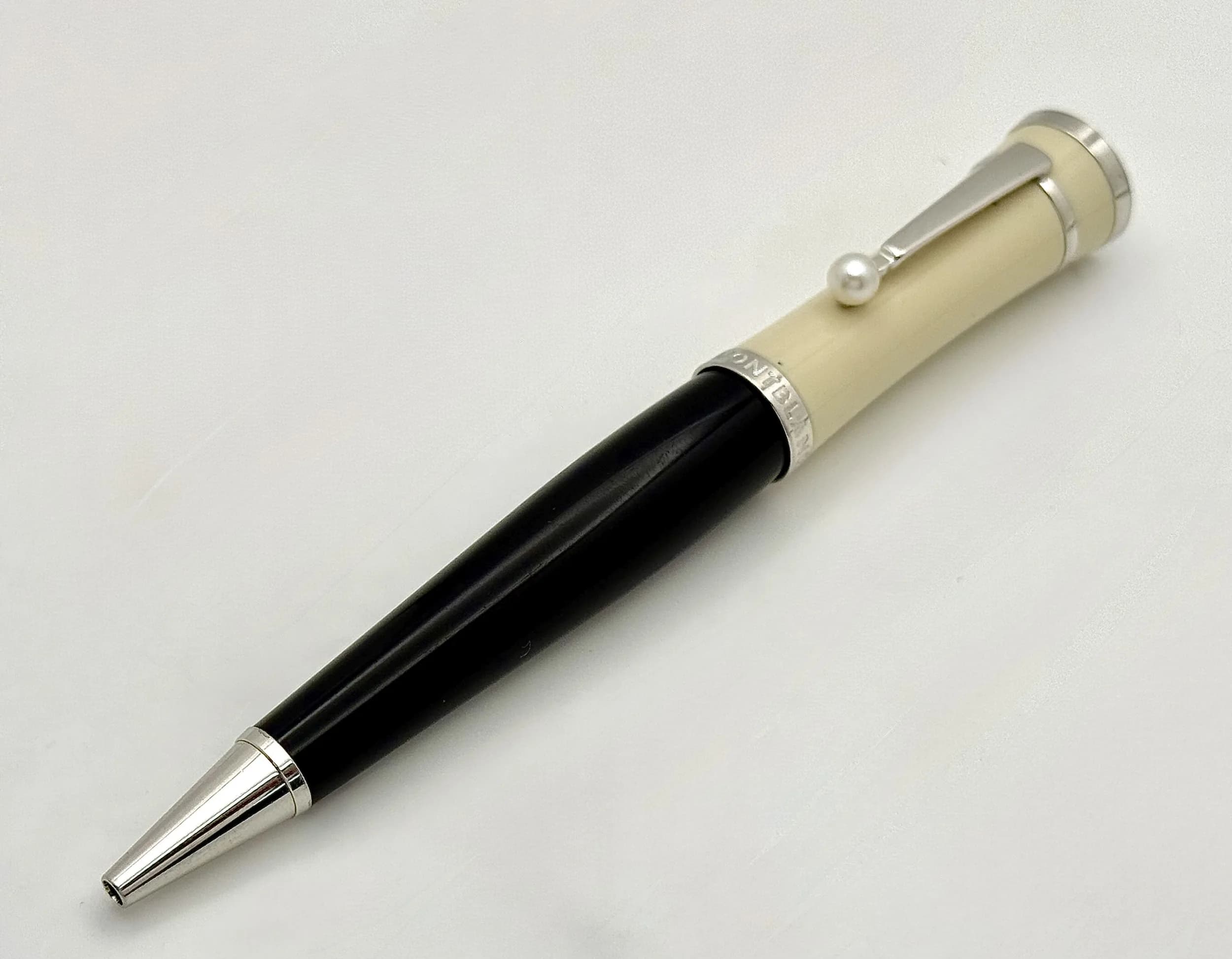 A Mont Blanc Greta Garbo Special Edition Ballpoint Pen. In working order. Black and ivory resin with pearl accent. 13cm.Ref: 029605