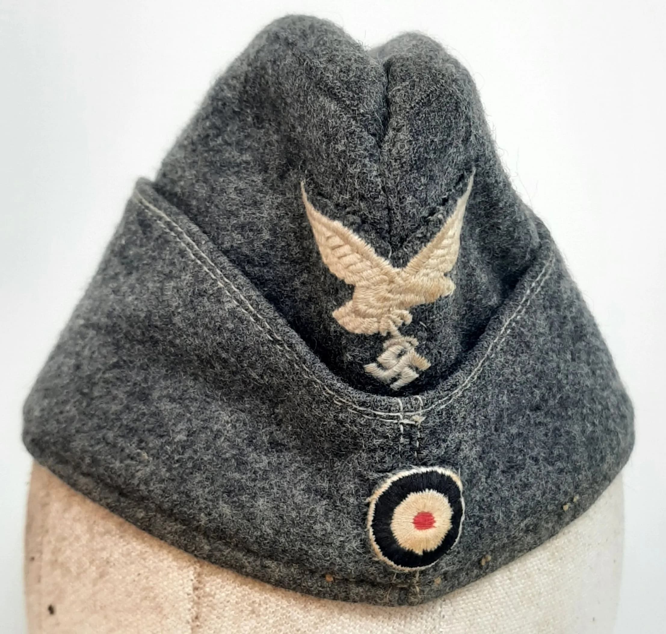 A WW2 German Air Force (Luftwaffe) Officers Overseas Side Cap. Embroidered Luftwaffe emblem. Markings in interior of Lazendorf Heil.