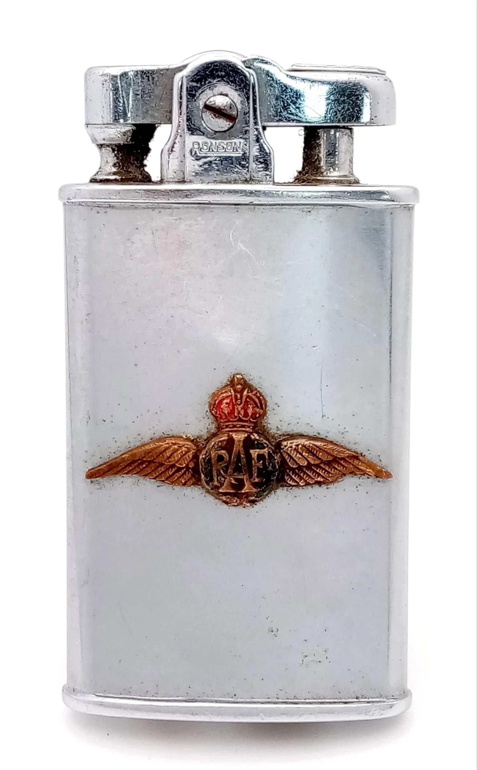Vintage RONSON PETROL LIGHTER with RAF WINGS ENAMELLED BADGE ATTACHED TO SIDE. Working order. Excellent condition, please see pictures. UK mainland shipping only.