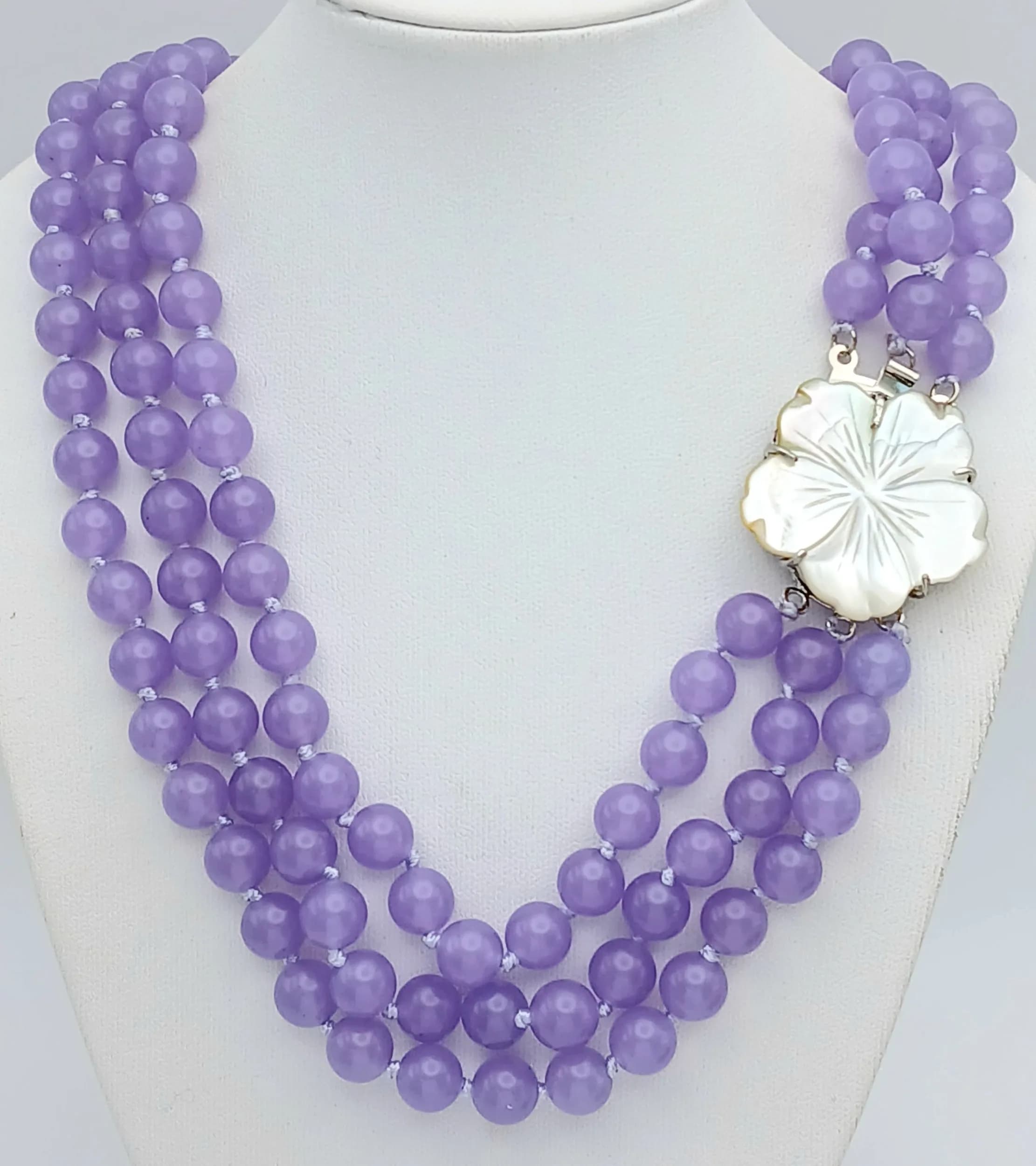 A Three Row Lavender Jade Beaded Necklace with Floral Form Clasp. 8mm beads. 42-46cm length.