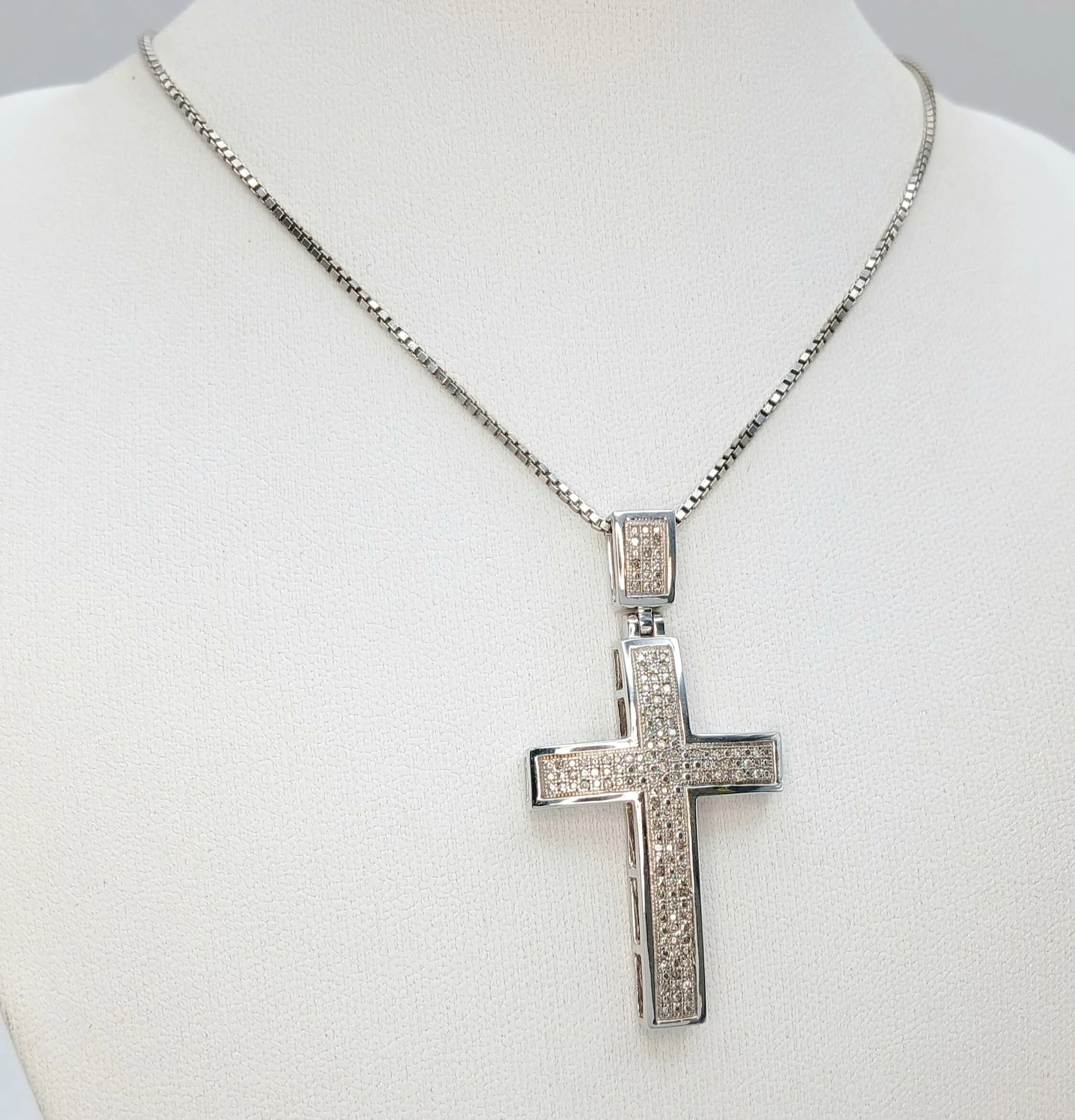A 925 Silver Stone Set Cross Pendant on a 925 Silver Chain. 5cm and 56cm. 13g total weight.