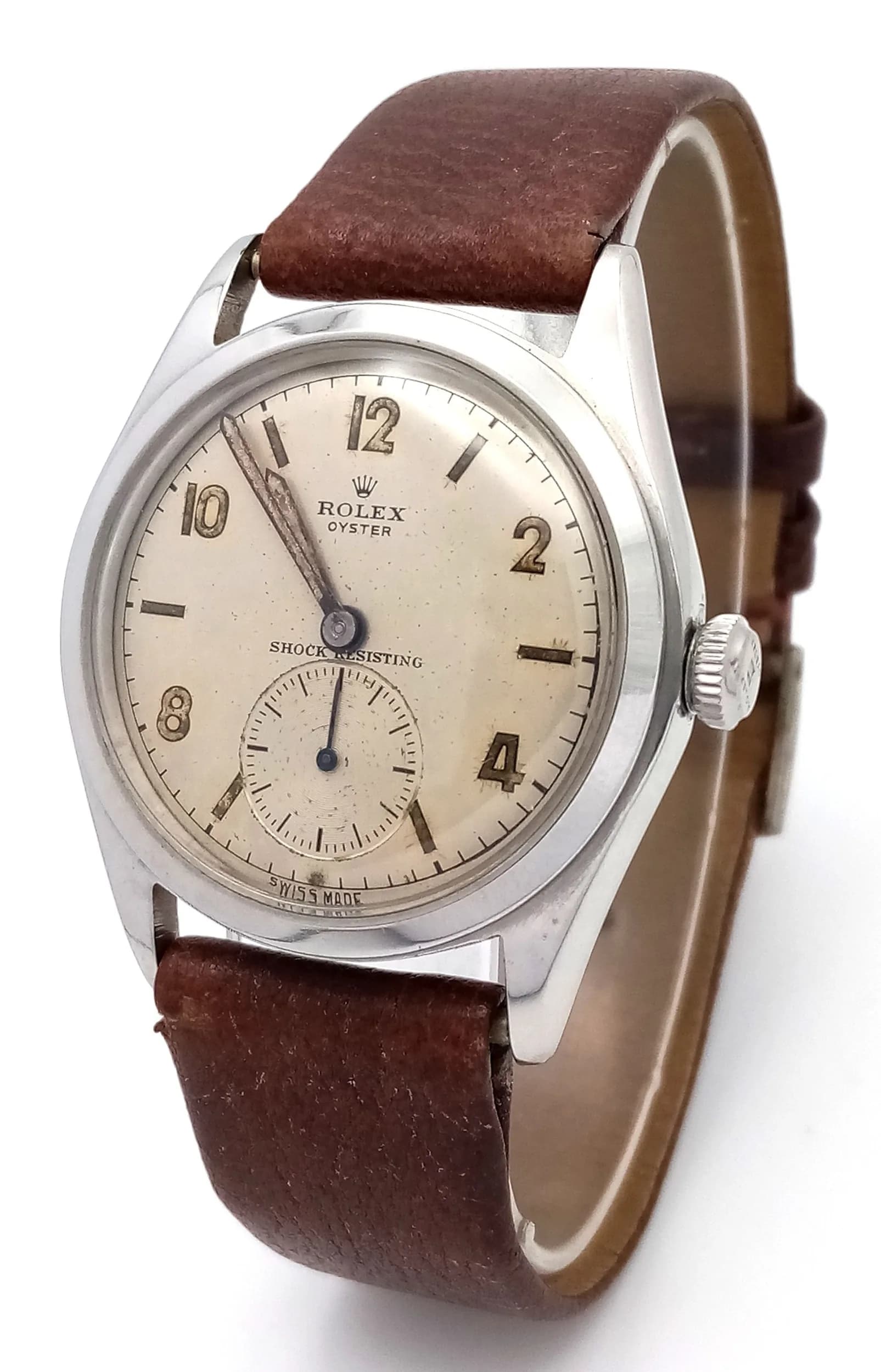 A Vintage Rolex Oyster Mechanical Gents Watch. Model 4499. Brown leather strap. Stainless steel case - 34mm. Cream dial with second sub dial. Pull-out, hand-wind feature. In working order. Ref: 029603.