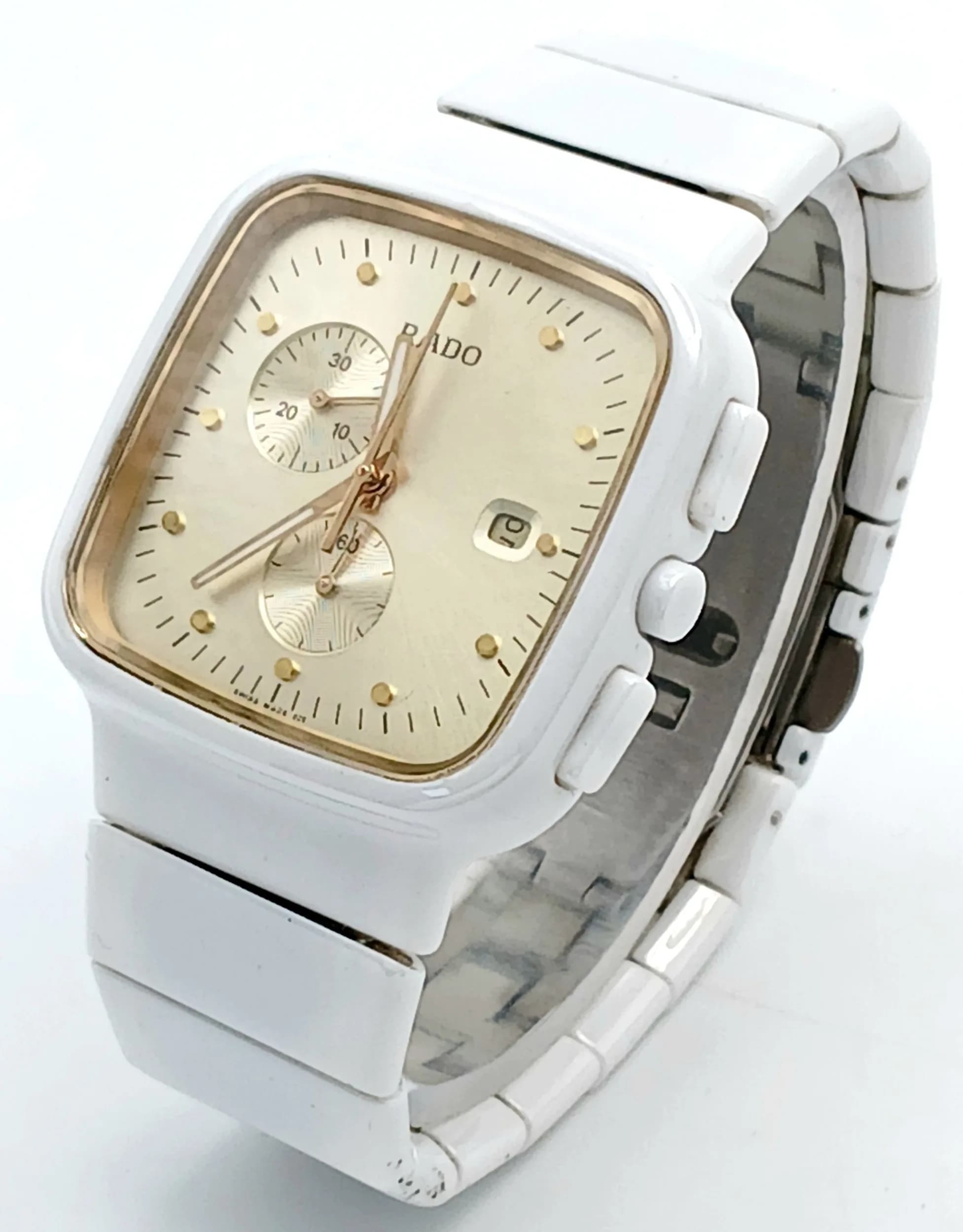 A Rado r5.5 Quartz Chronograph Ladies Watch. White ceramic bracelet and case - 36mm. Gold tone dial with two sub dials and date window. In working order.