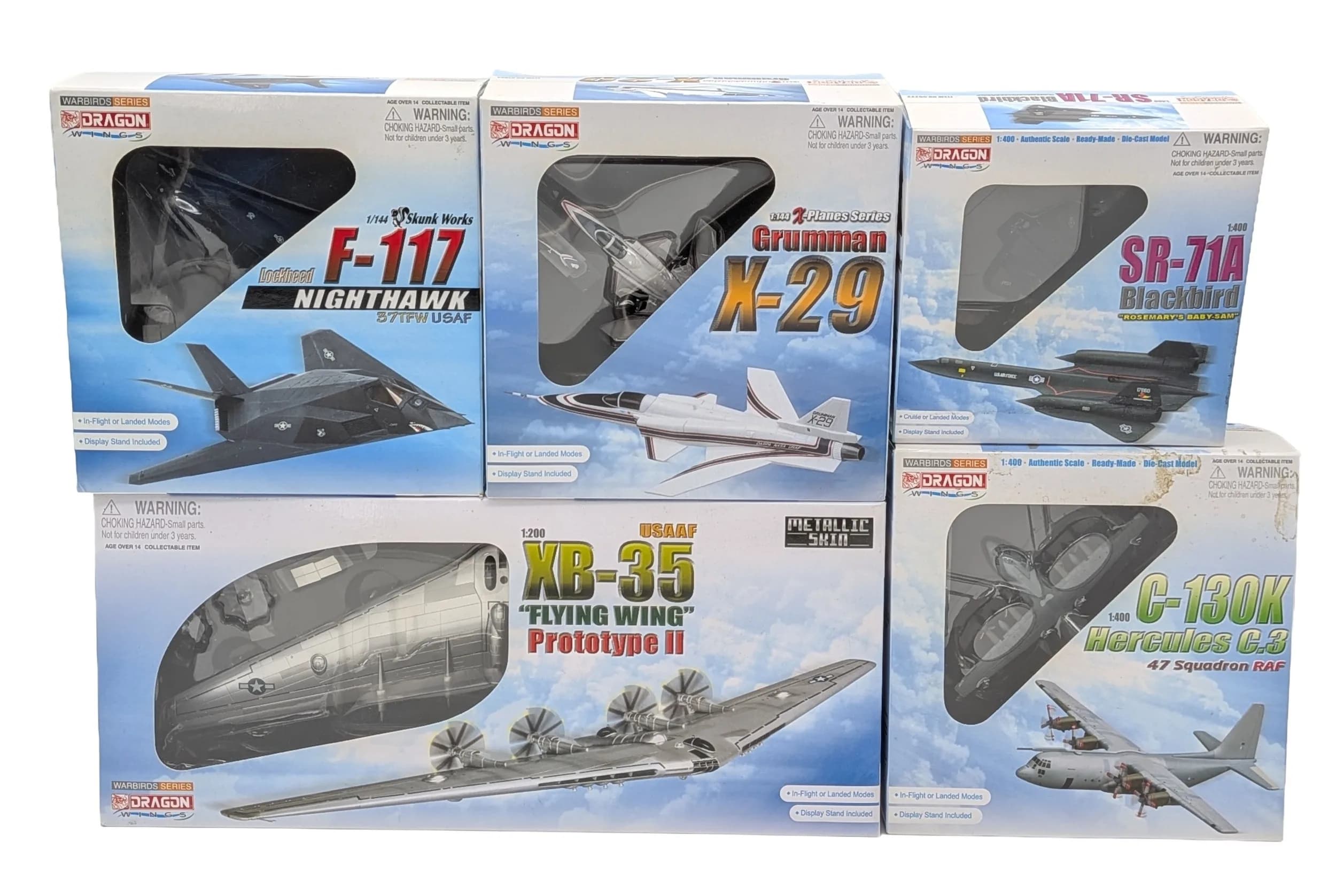 Five Dragon models, warbirds series die cast model aeroplanes. To include a Northrop XB-35 "flying wing" prototype II, 1/200 scale, a Lockheed SR-71A Blackbird "Rosemary's Baby-San", 1/400 scale, a Lockheed F-117 Nighthawk, a Lockheed C-130K Hercules C.3, 1/144 scale and a Grumman X-29 Experimental aircraft, 1/144 scale. These discontinued, collectable models are in very good condition. They have never been out of their boxes on display.