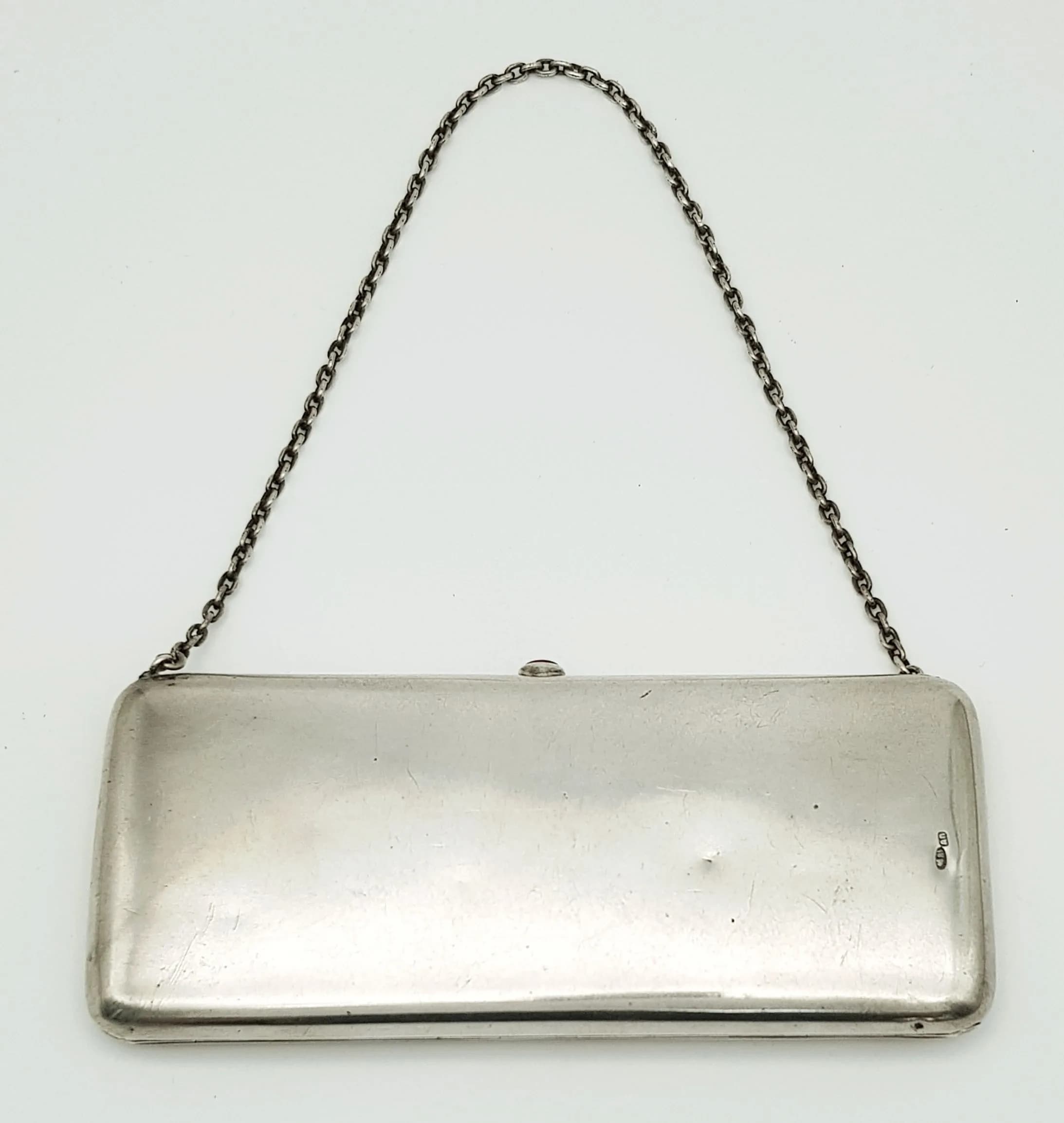 AN ANTIQUE SOLID SILVER RUSSIAN PURSE WITH A RUBY AND ON A CHAIN . 210 3gms 16 x 6.5cms apprx
