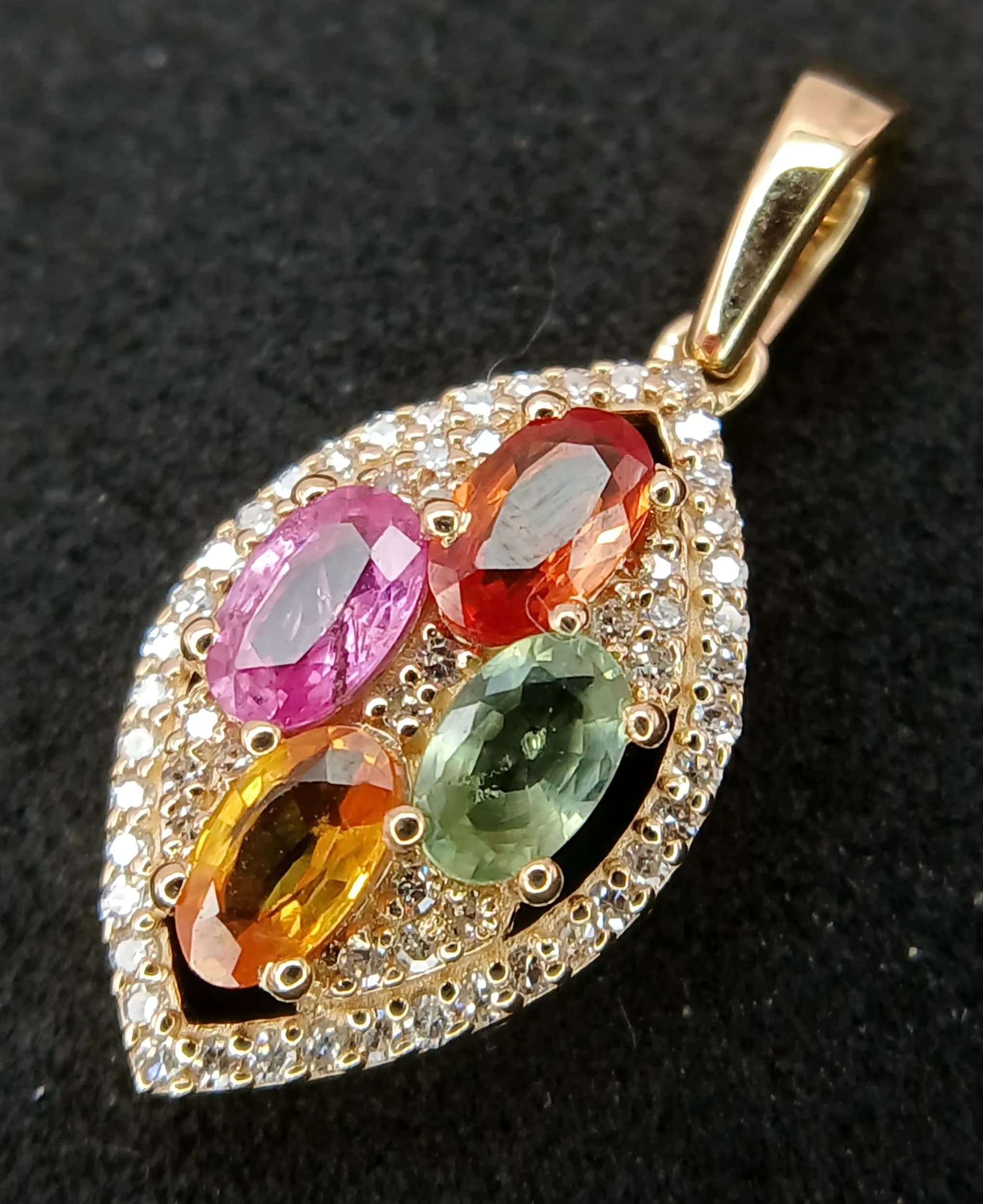 A 14K Gold, 1.18ctw Multi Sapphire and Diamond Pendant. 25mm length. 0.18ctw of diamond accents. Comes with an HRD Antwerp certificate. Ref: CLP-12910. 1.73g total weight.