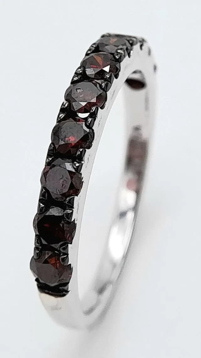 A Far Eastern Design Sterling Silver and Red Diamond Ring Size Q. The Ring is set with Ten 2mm Round Cut Red Diamonds, approximately 0.30 carat total and weighs 2.19 grams.